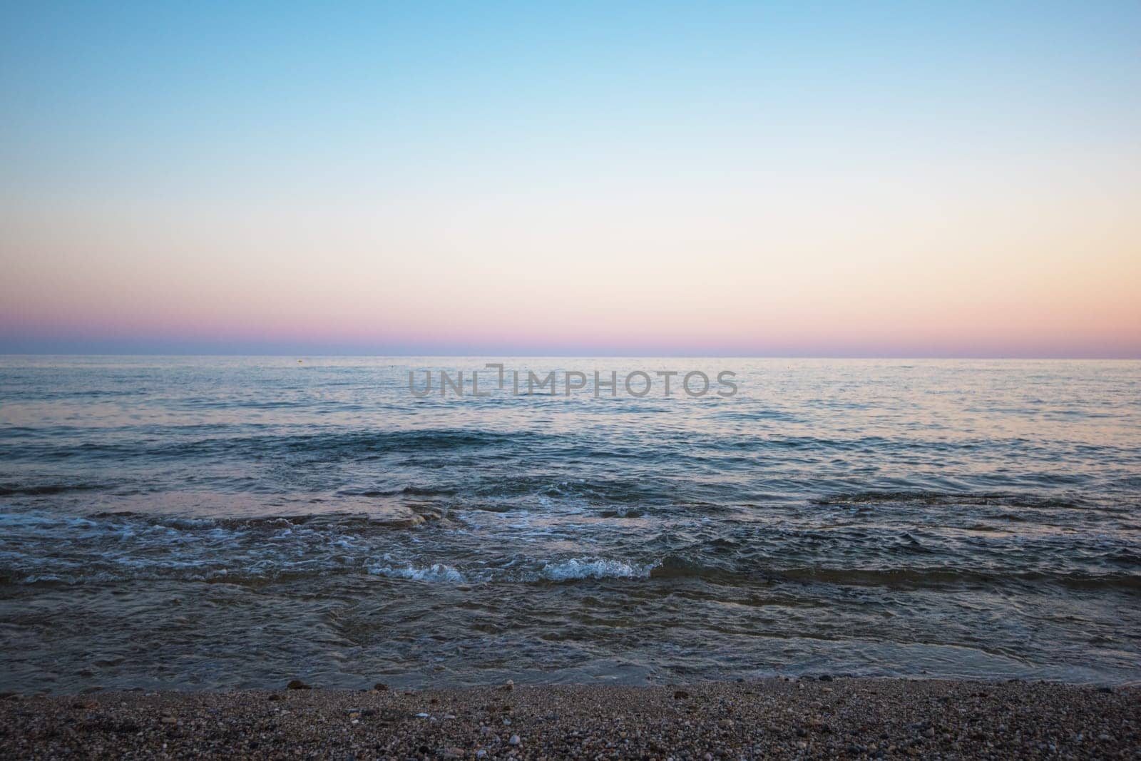 Blue sea with waves in the evening