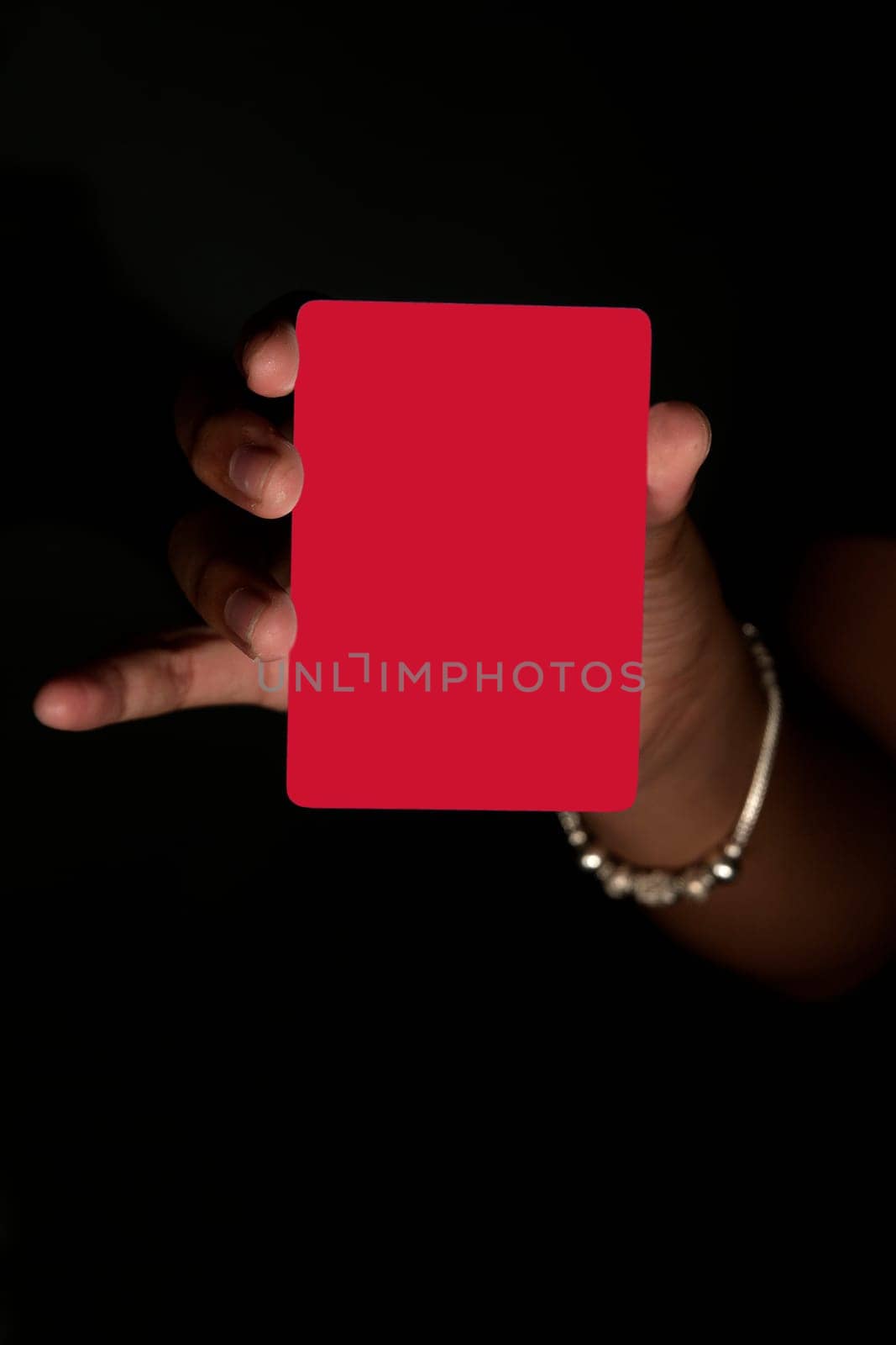 red card hand holding