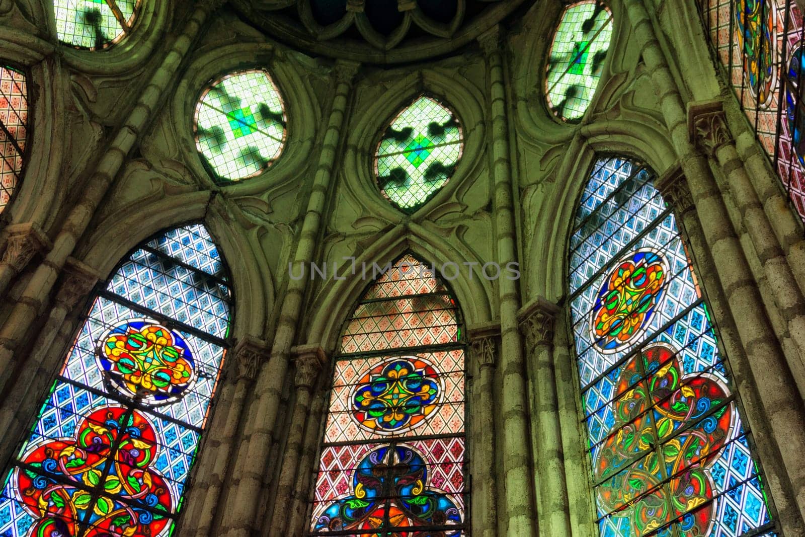 QUITO, ECUADOR - DECEMBER 28: Colorful stained glass windows in the Basilica of the National Vow in Quito, Ecuador on December 28, 2014