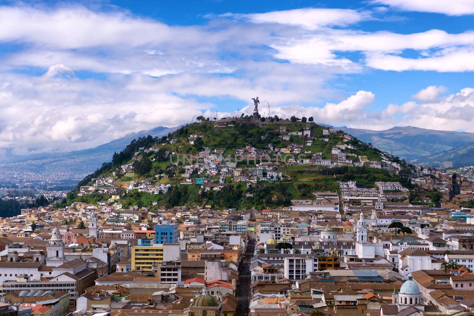 View of the historic center of Quito, Ecuador as with Panecillo hill rising in the background