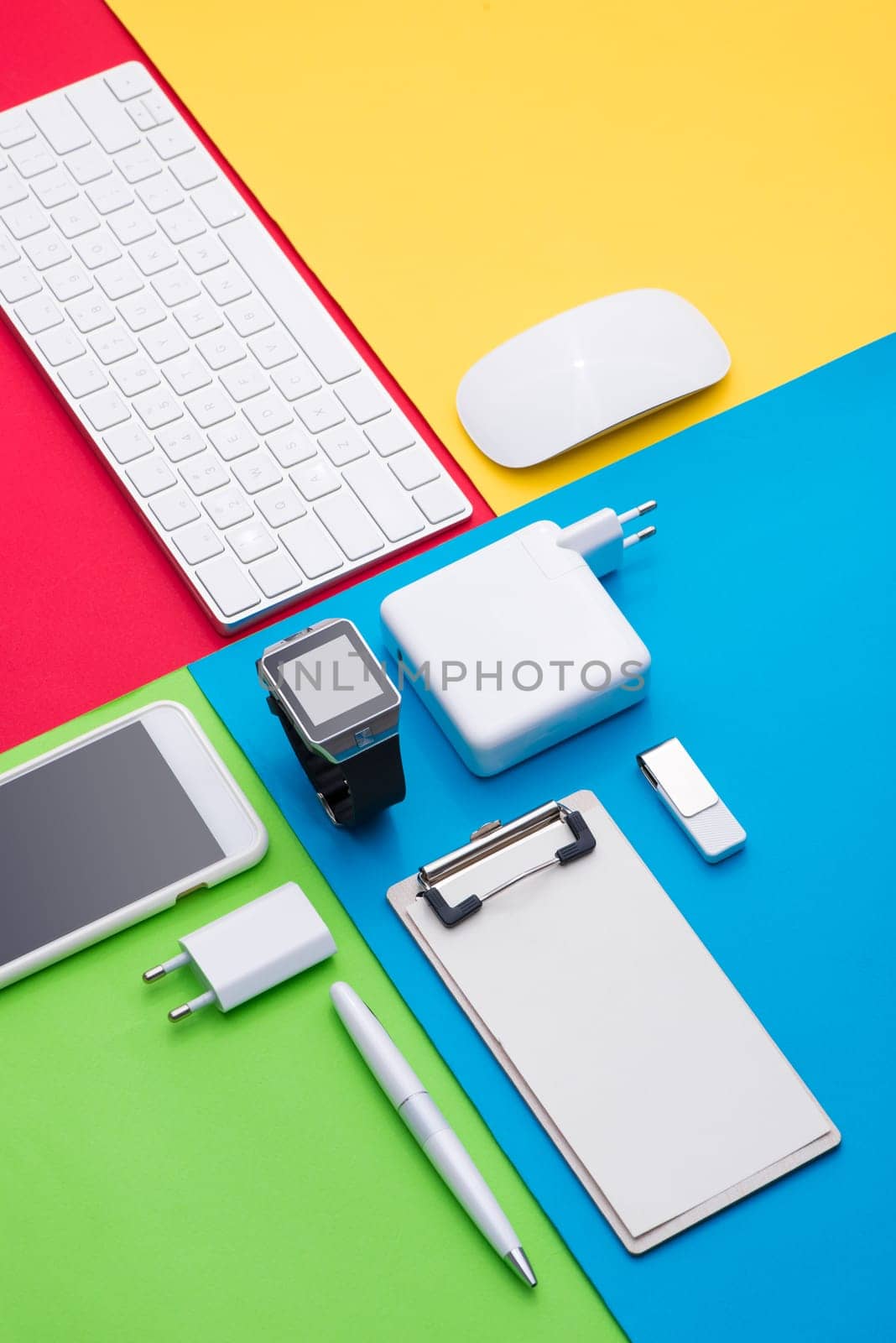 Well organised white office objects on colorful background