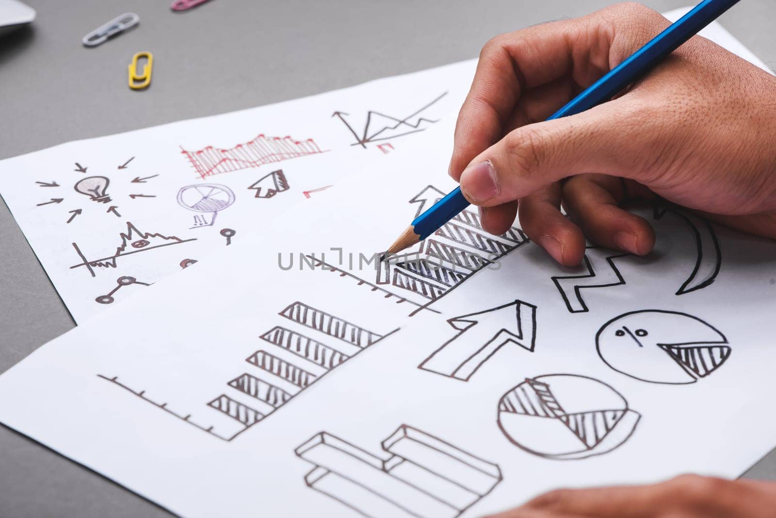 Business concept. Businessman writing idea sketch