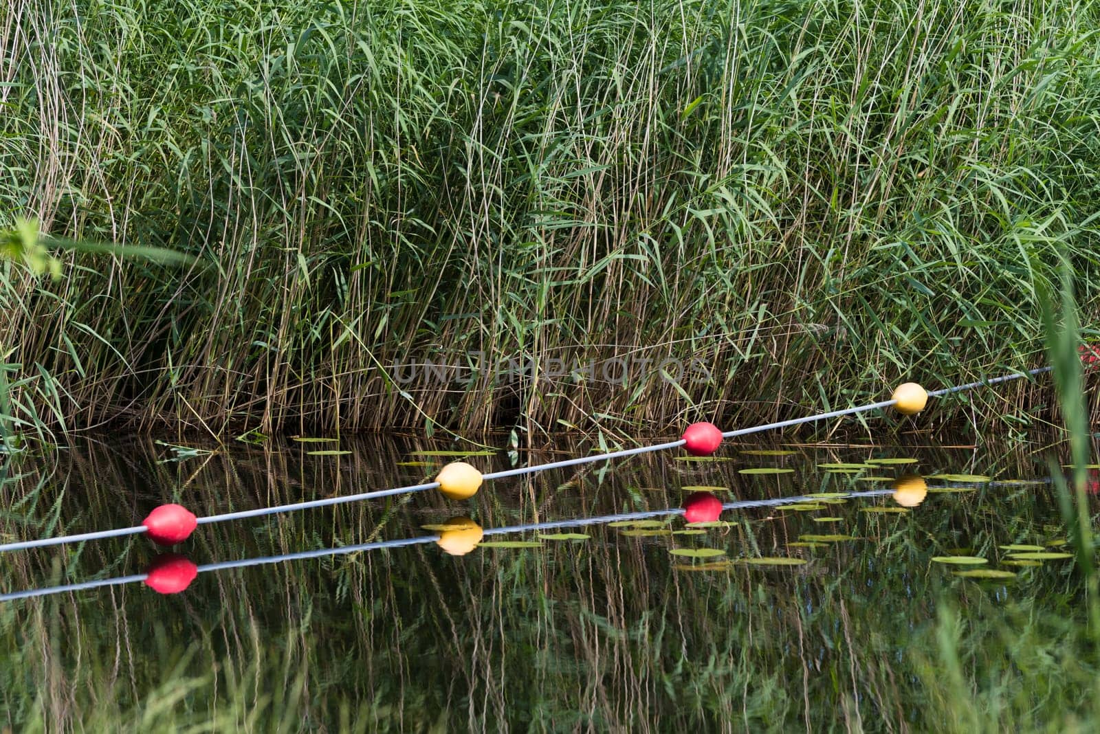 buoy line over a canal to prevent small boats to pass