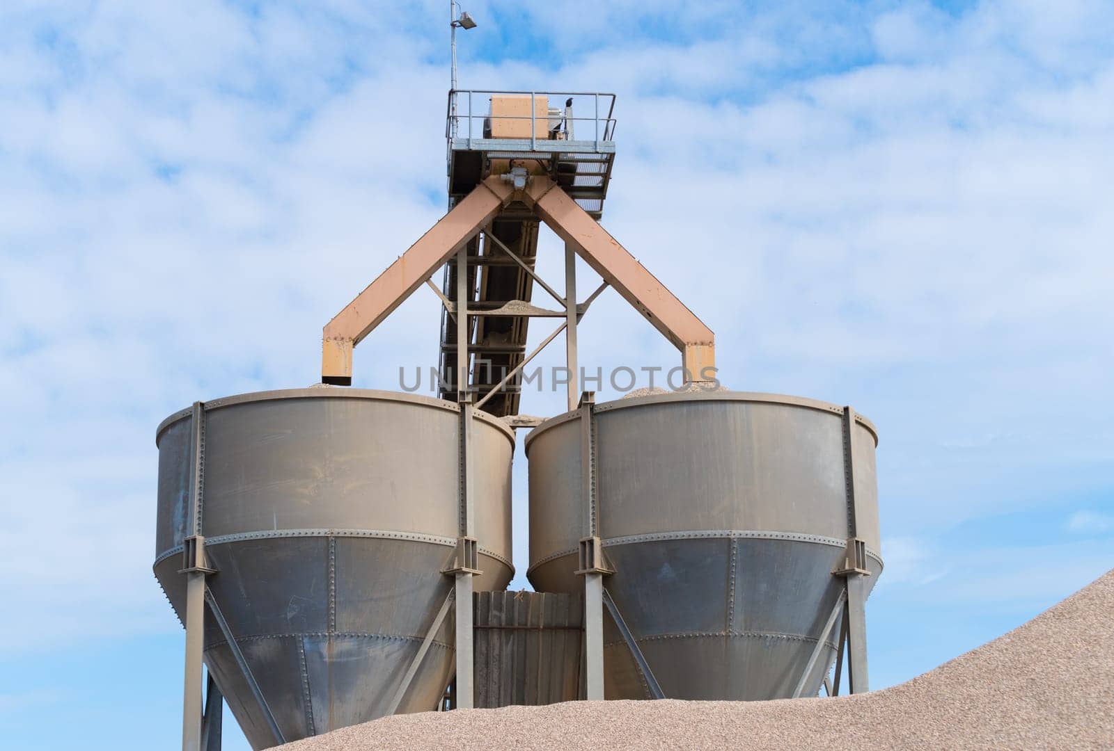 two large funnels at a cement factory