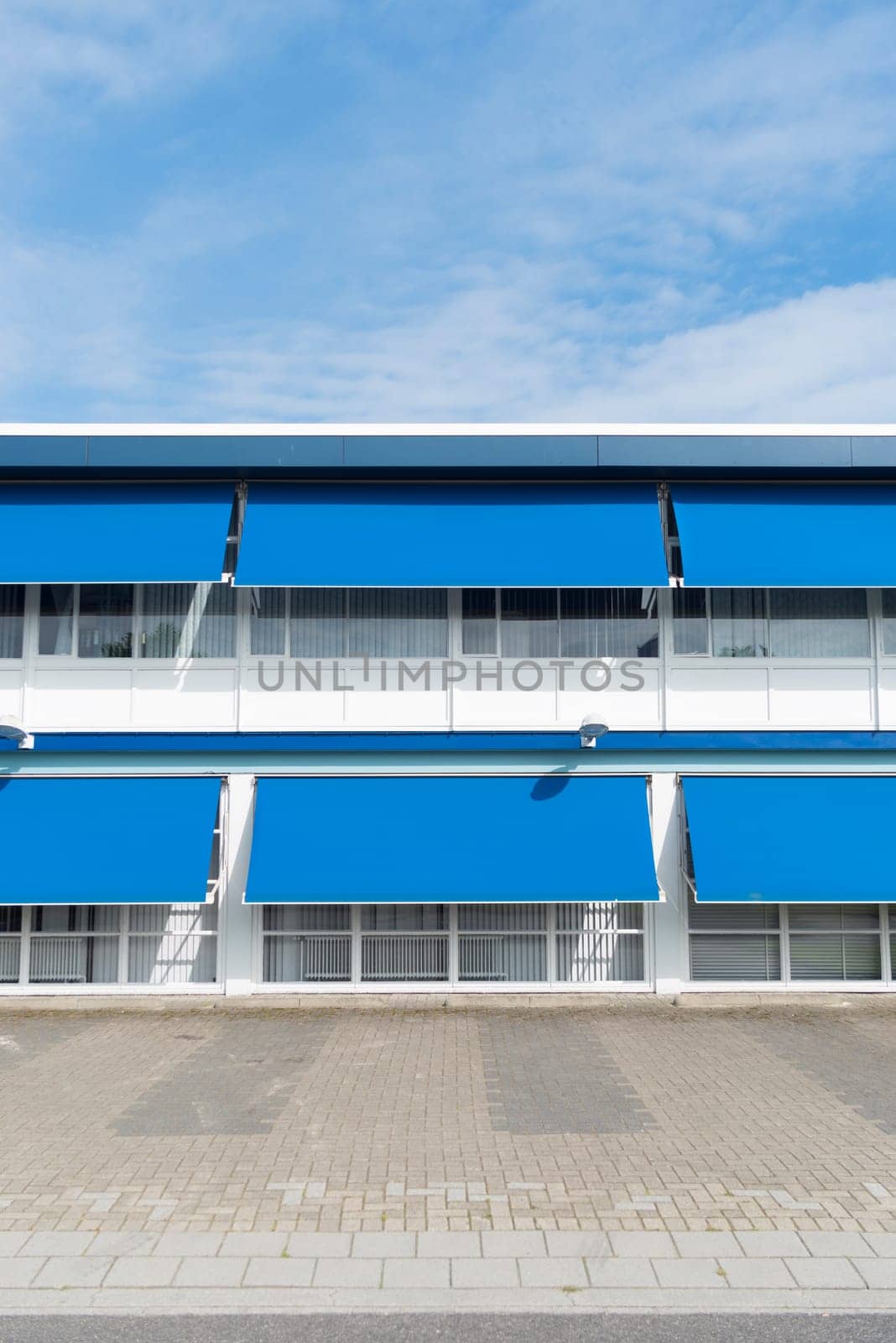 small office building with blue sun shades