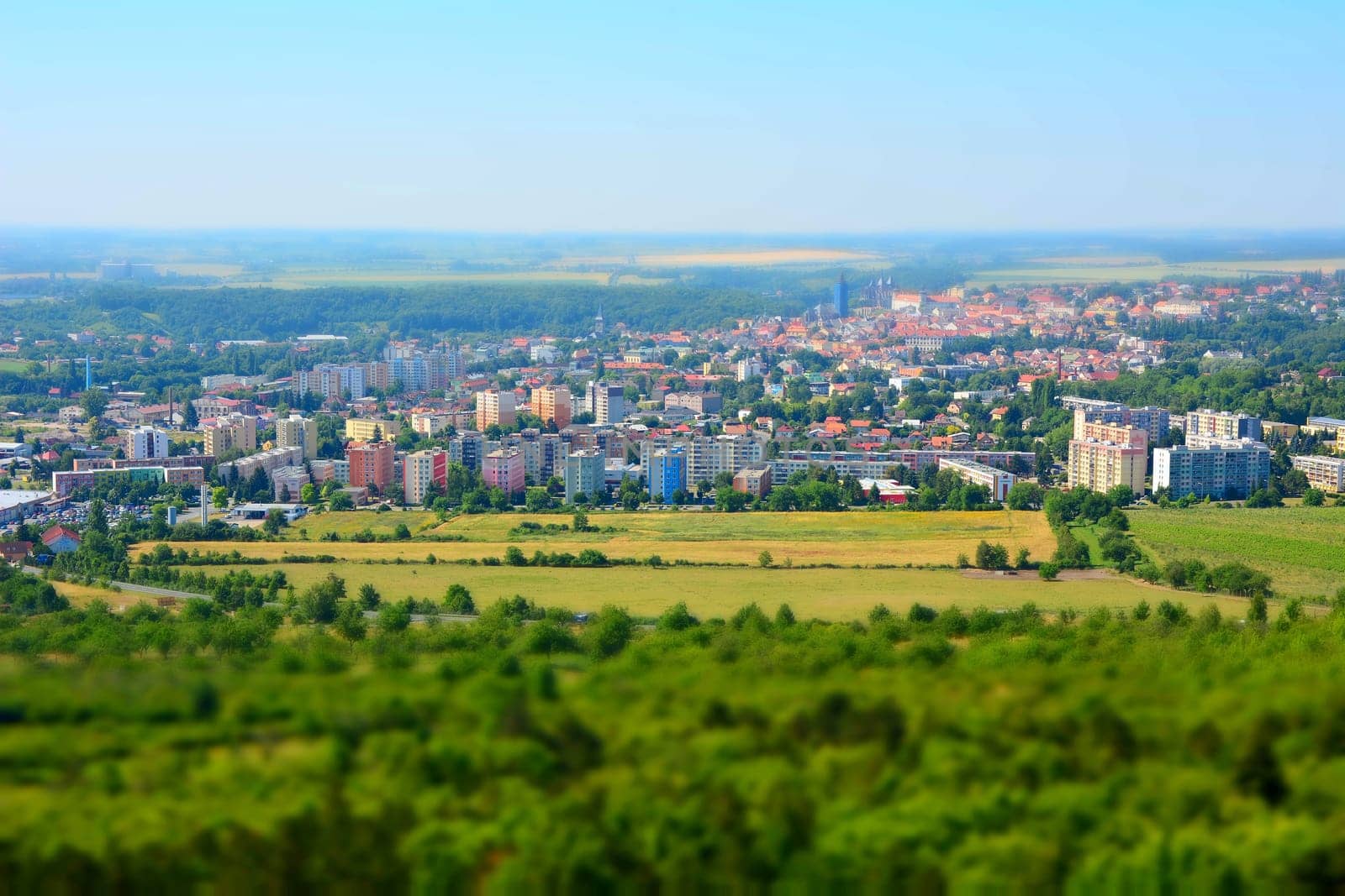 Tilt shift landscape panorama of the Kutna Hora city and forest in the Czech Republic.