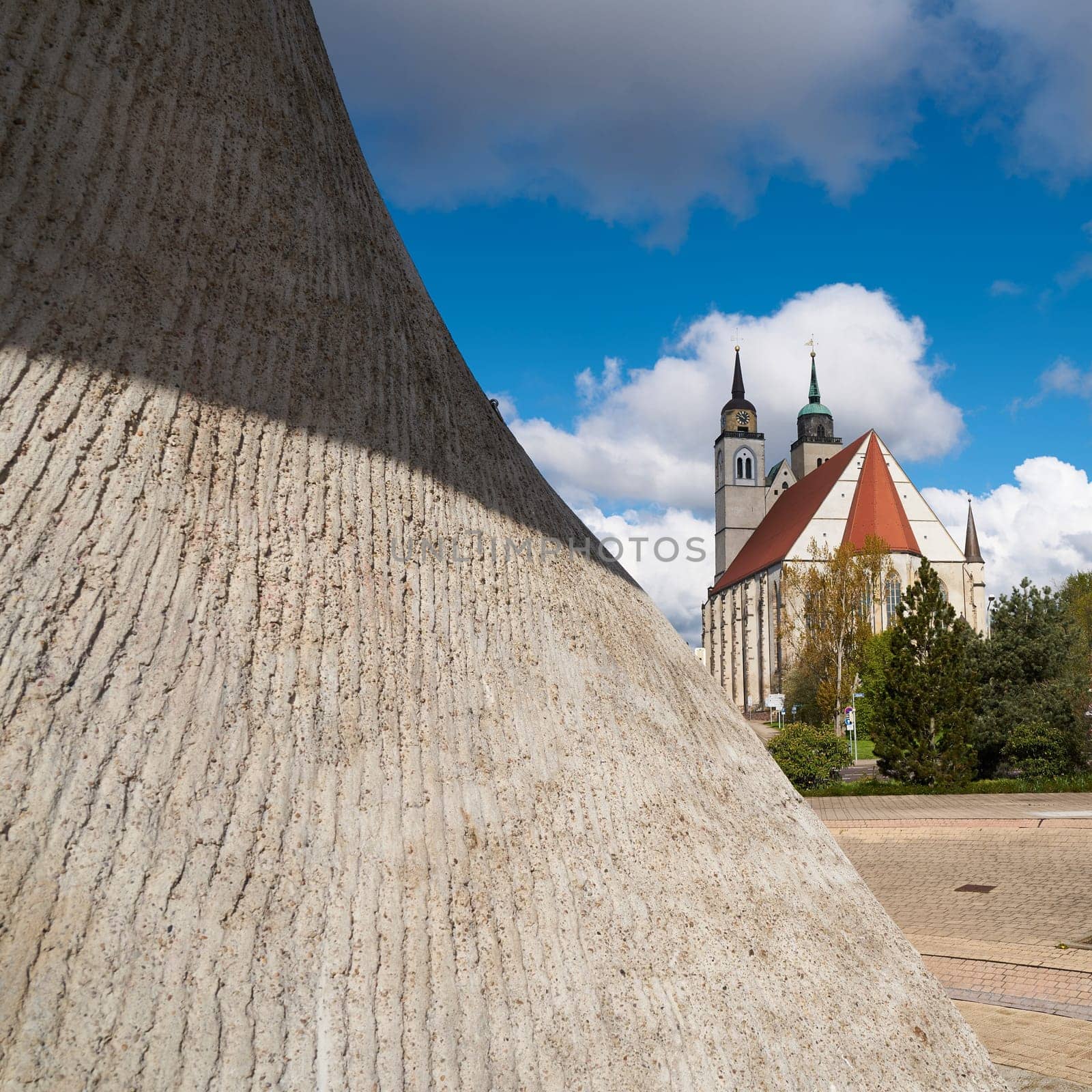 Flag monument and St. John's Church on the banks of the Elbe in Magdeburg.