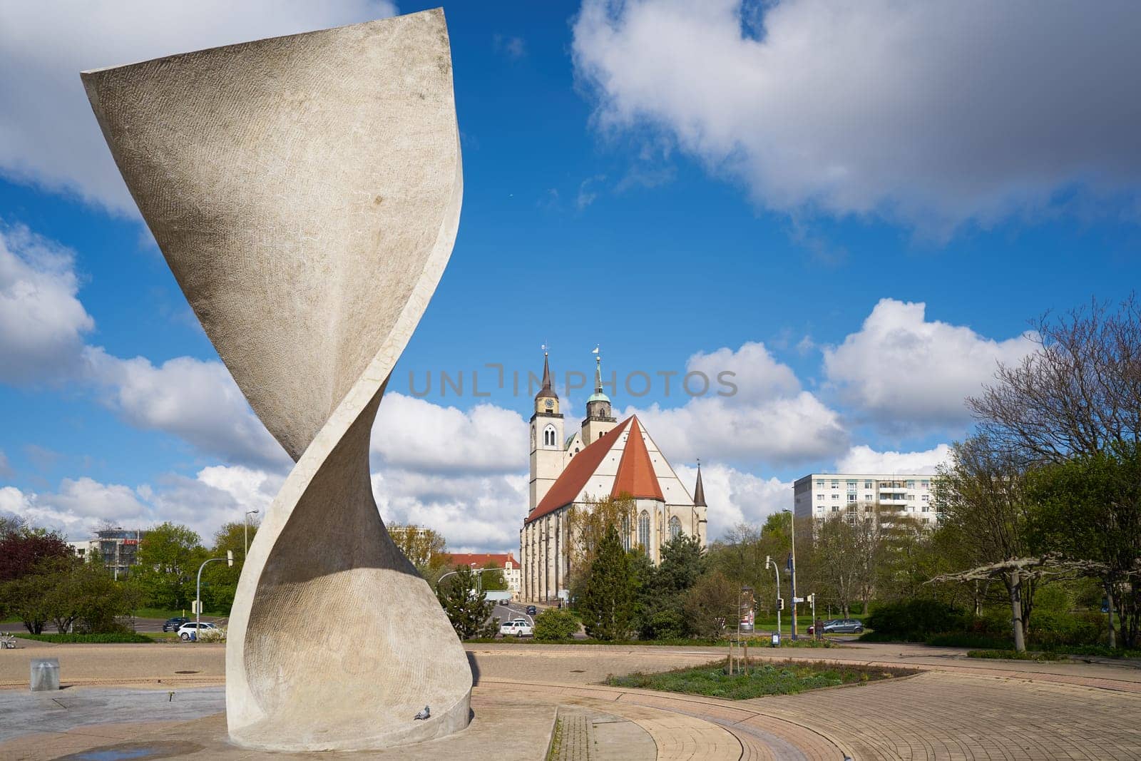 Flag monument and St. John's Church on the banks of the Elbe in Magdeburg.