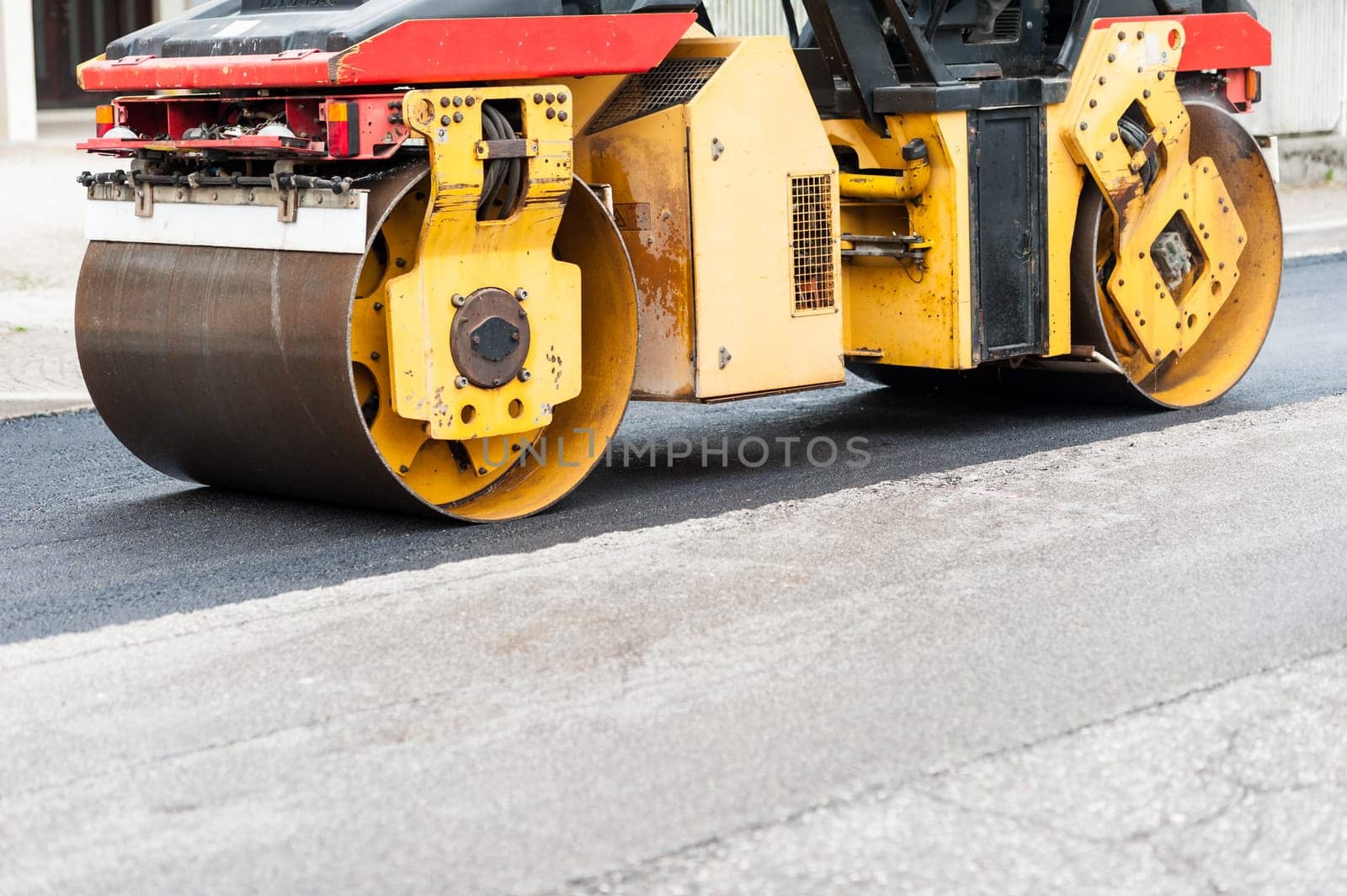 Heavy Vibration roller compactor at asphalt pavement works for road repairing