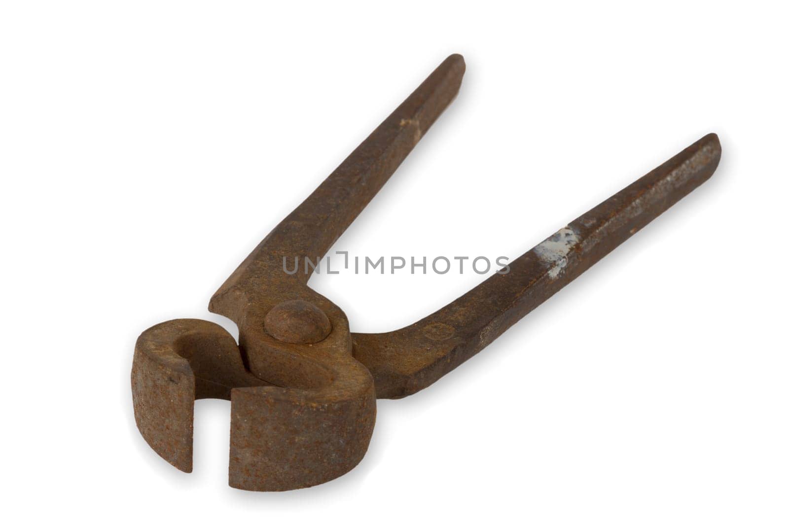 Old rusted pliers exposed on white background