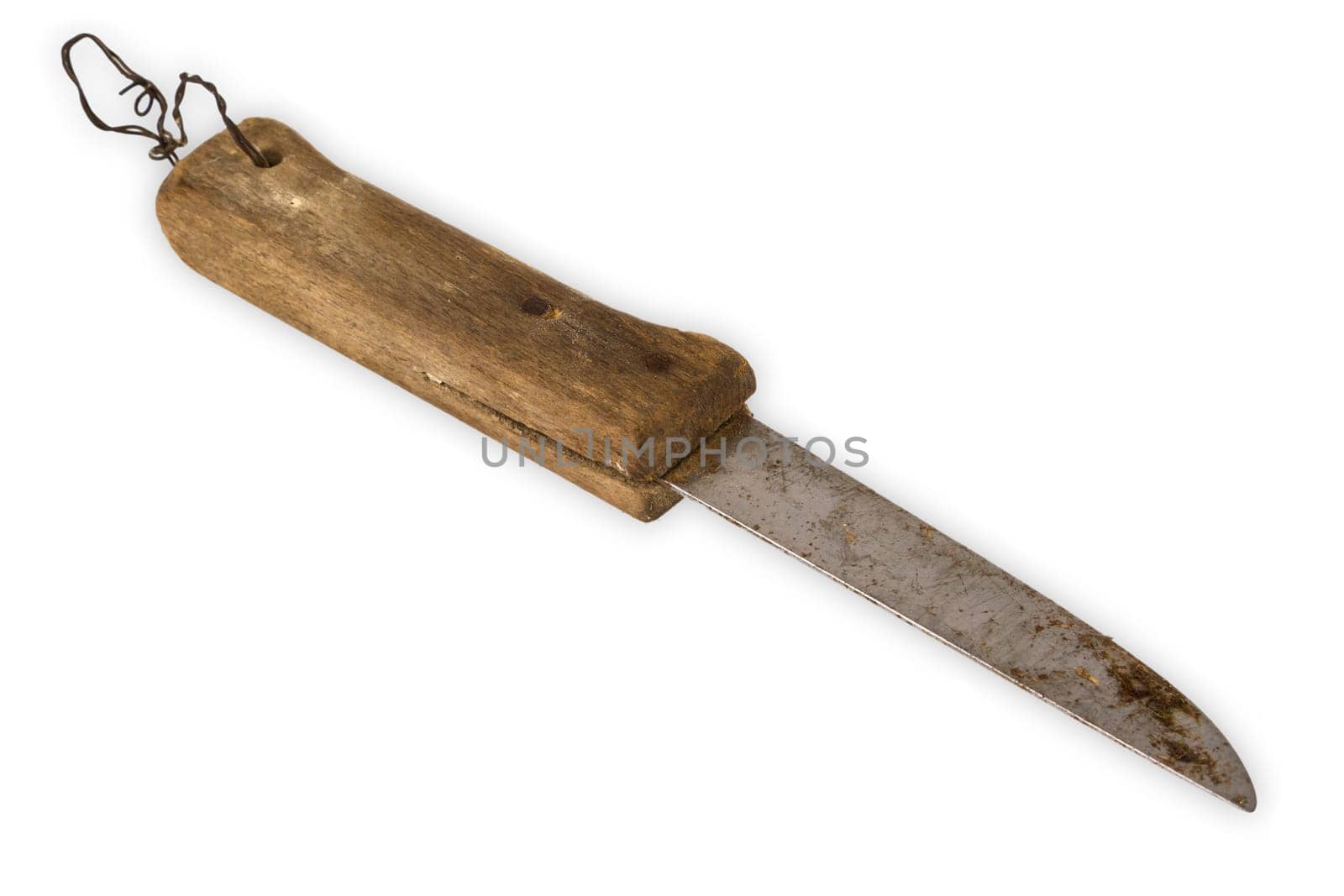 Old knife with wooden handle on a light background