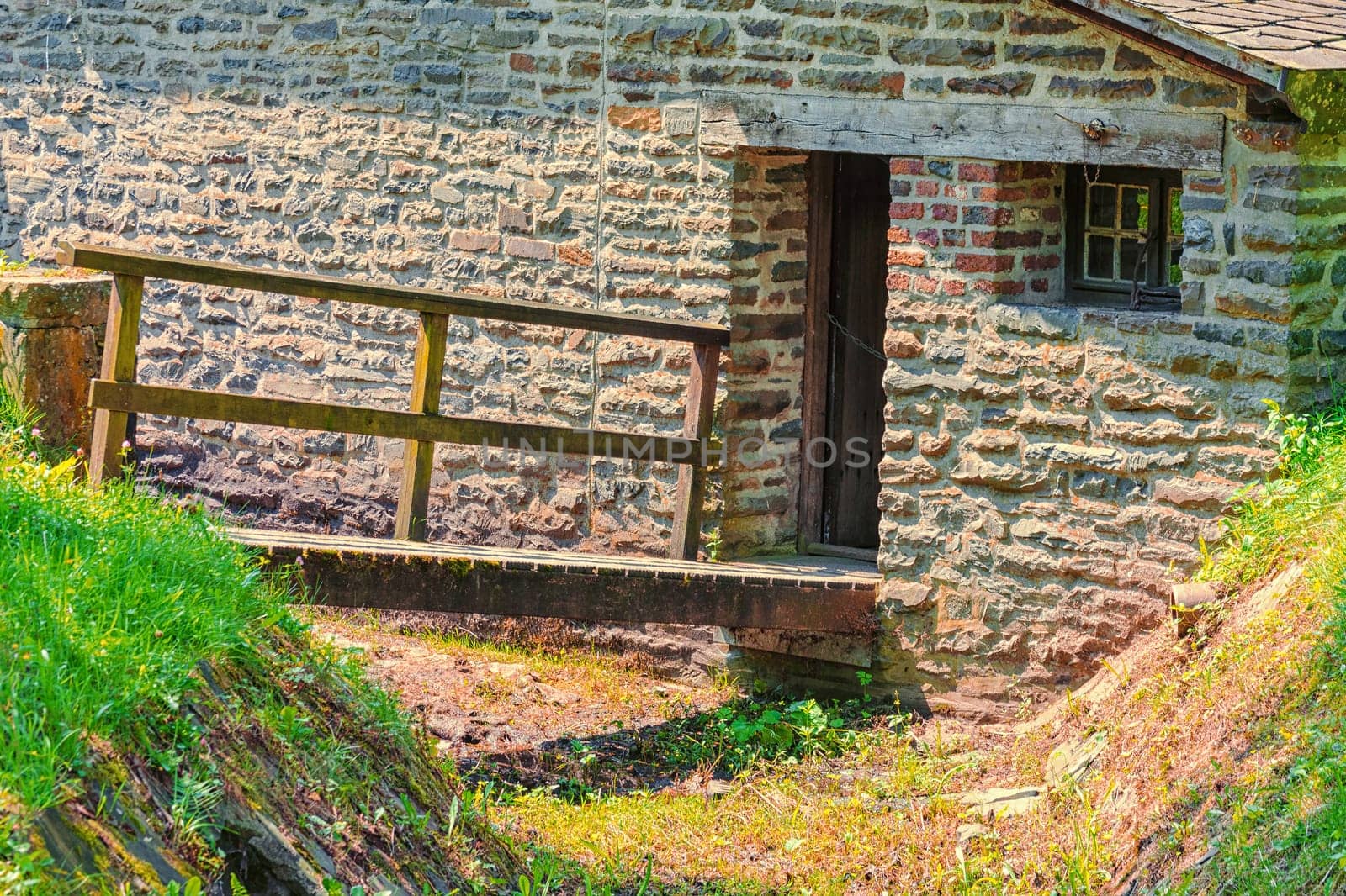 Idyllic alpine refuge or chalet in summer on a mountain meadow.