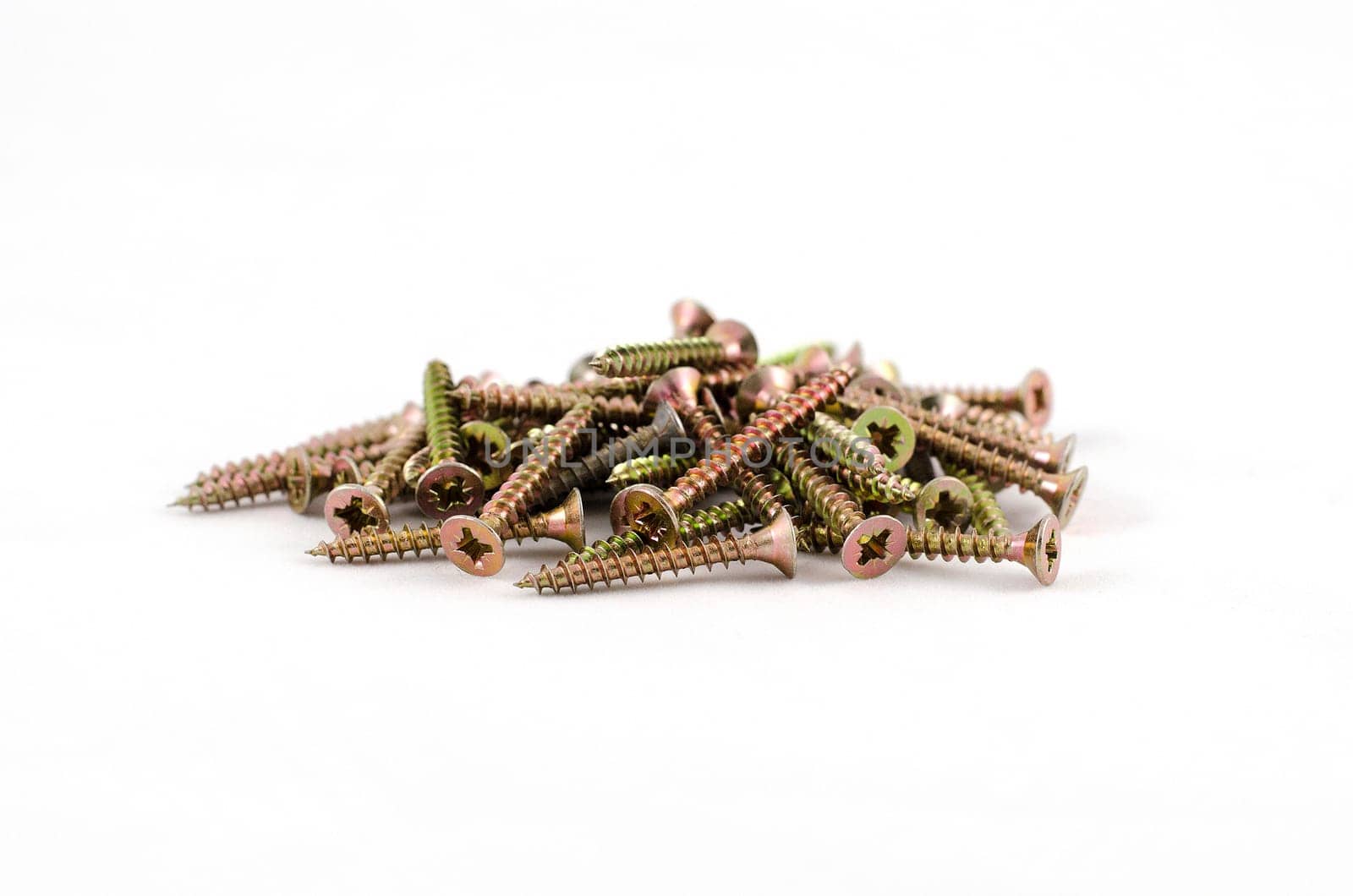 Zinked and anodized screws frame. Close-up. Macro.