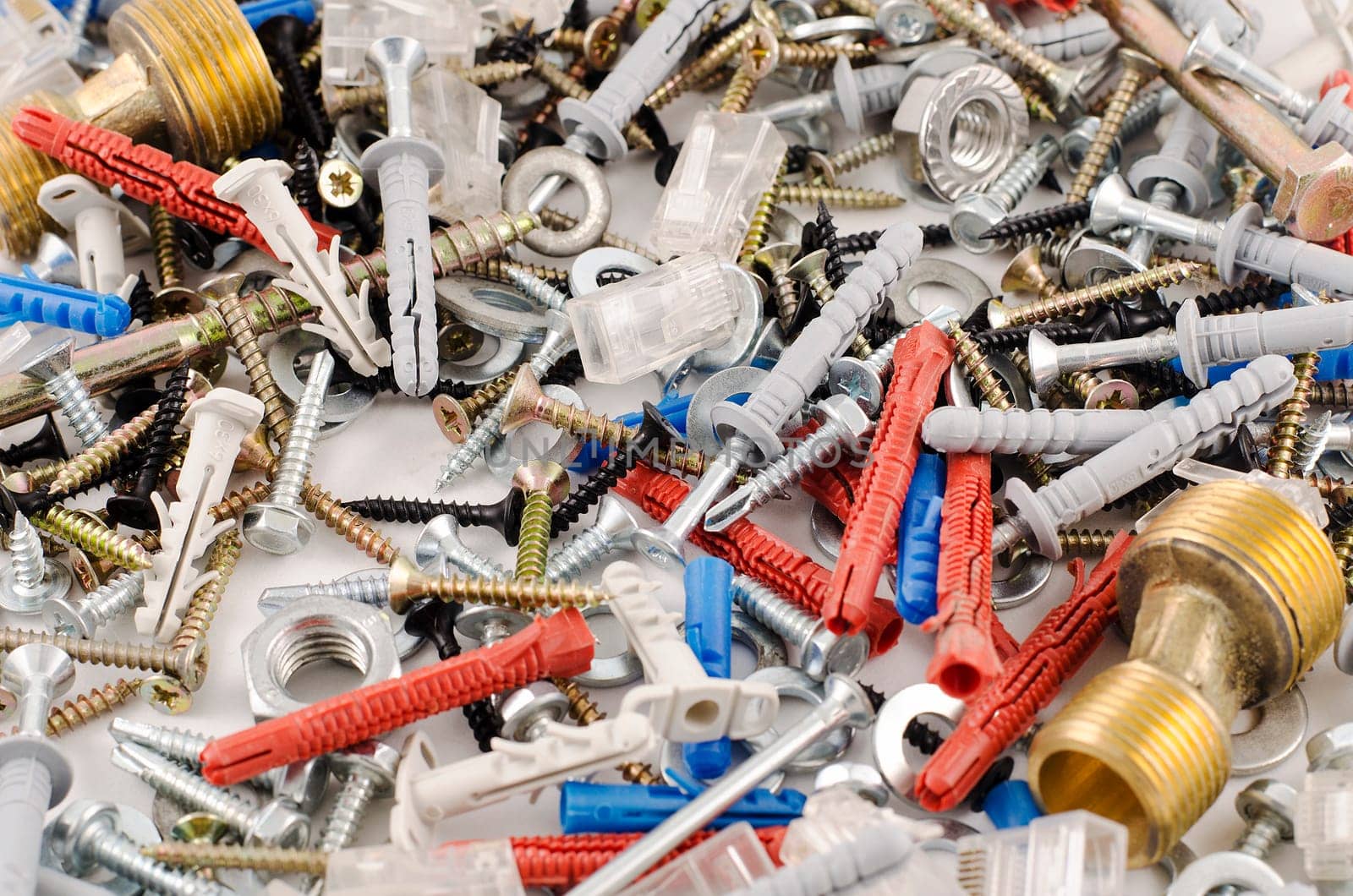 Nuts bolts and screws isolated over white background