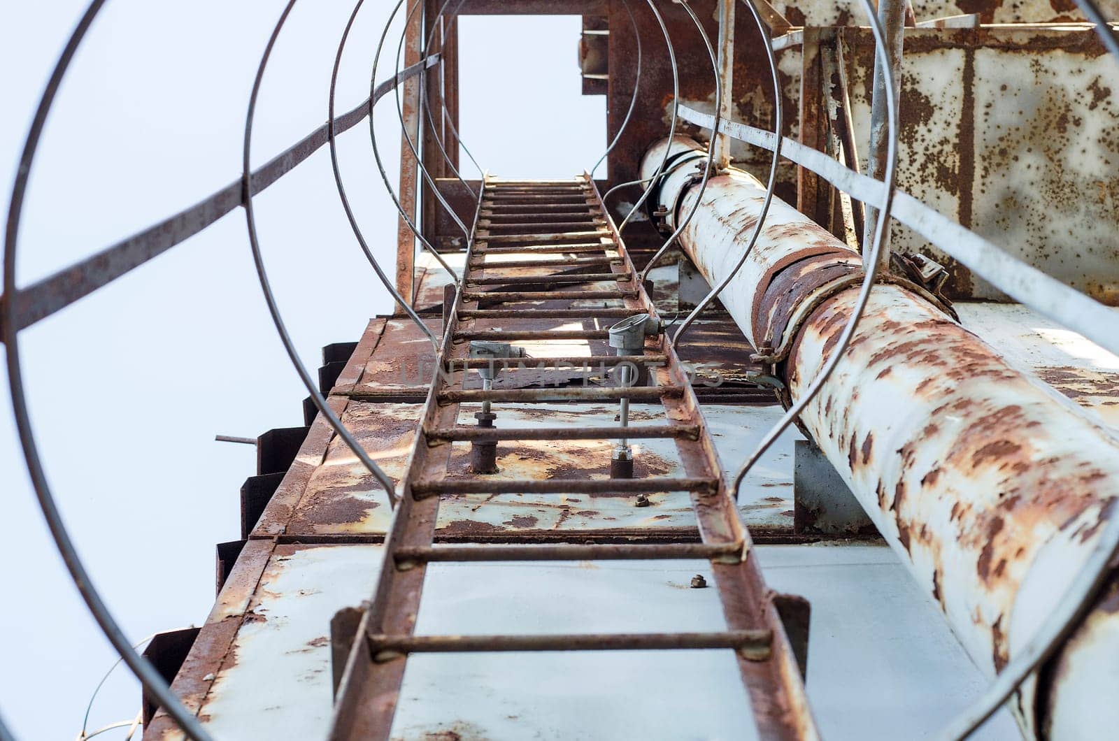 Rusty ladder on an abandoned building site