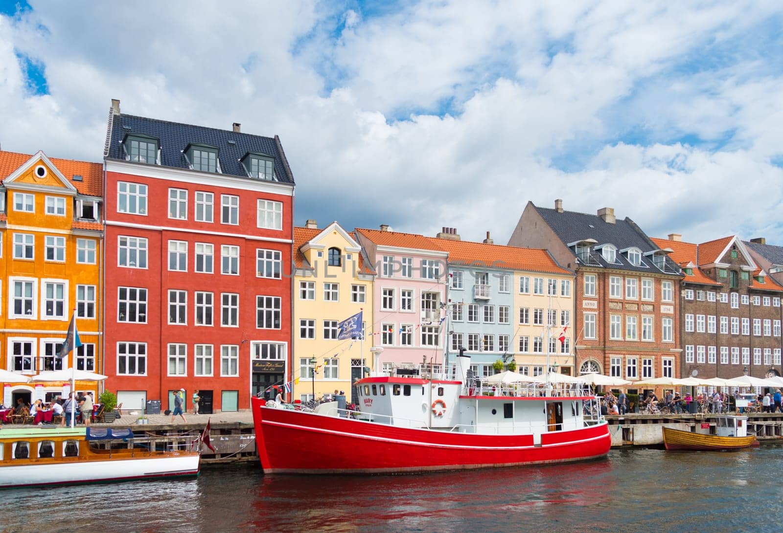 COPENHAGEN, DENMARK - JULY 31, 2016: Summer view of the famous Nyhavn with its colorful buildings