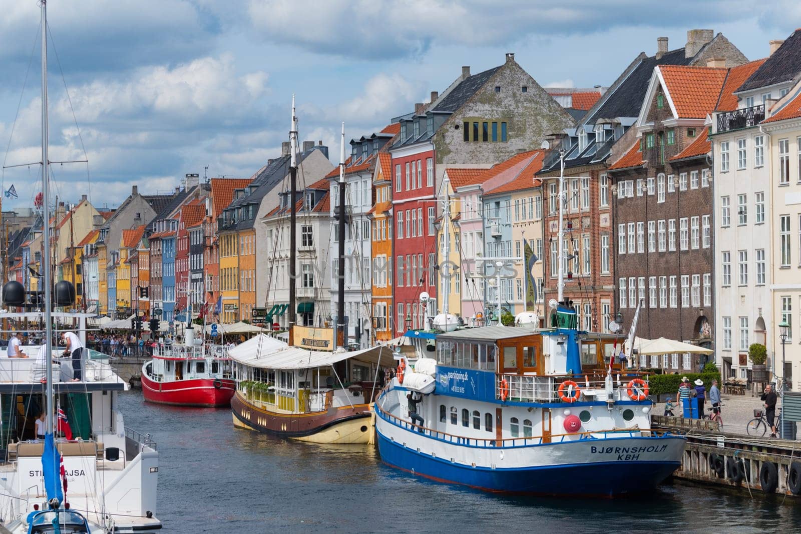 COPENHAGEN, DENMARK - JULY 31, 2016: Summer view of the famous Nyhavn with its colorful buildings