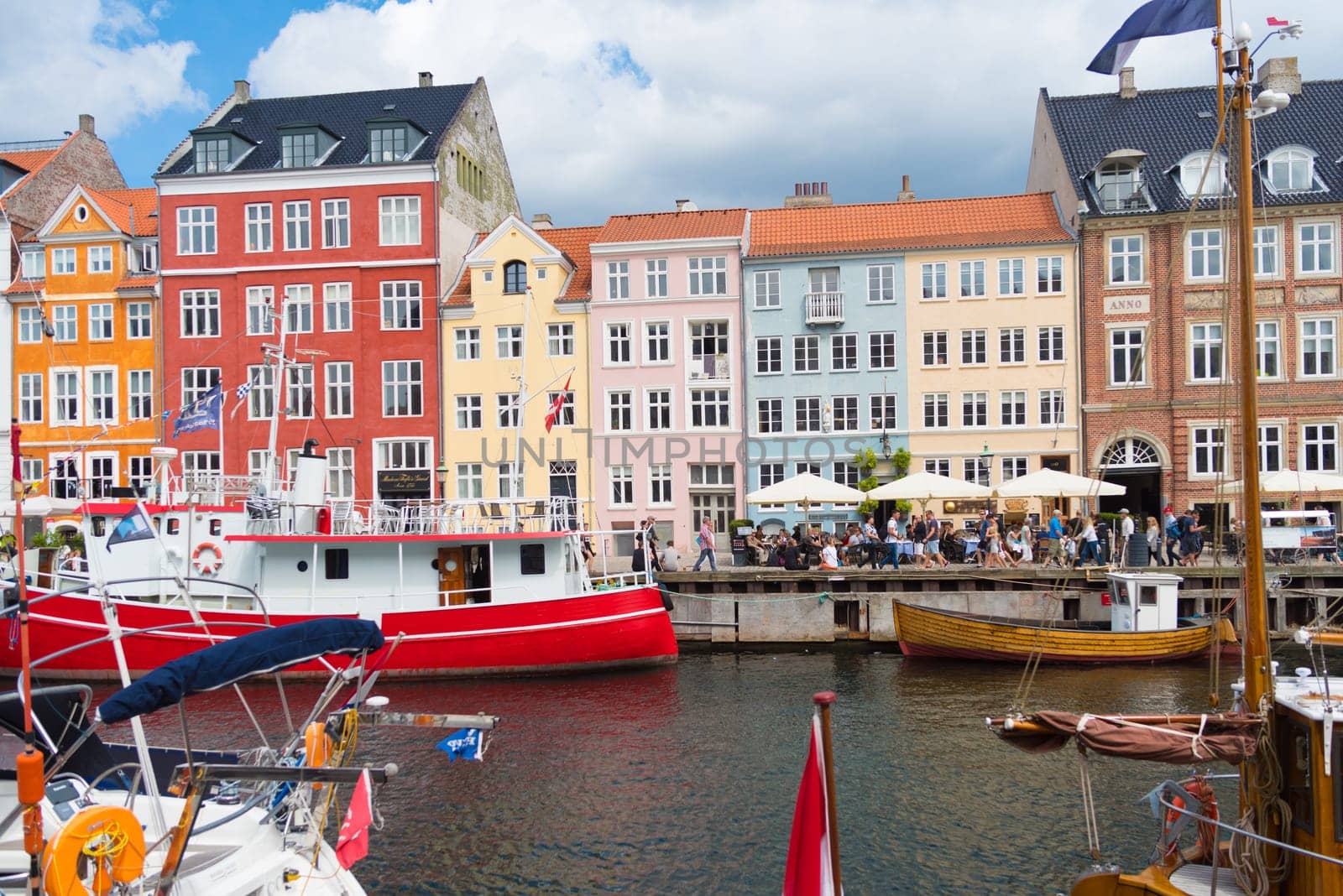 COPENHAGEN, DENMARK - JULY 31, 2016: Summer view of the famous Nyhavn with its colorful buildings