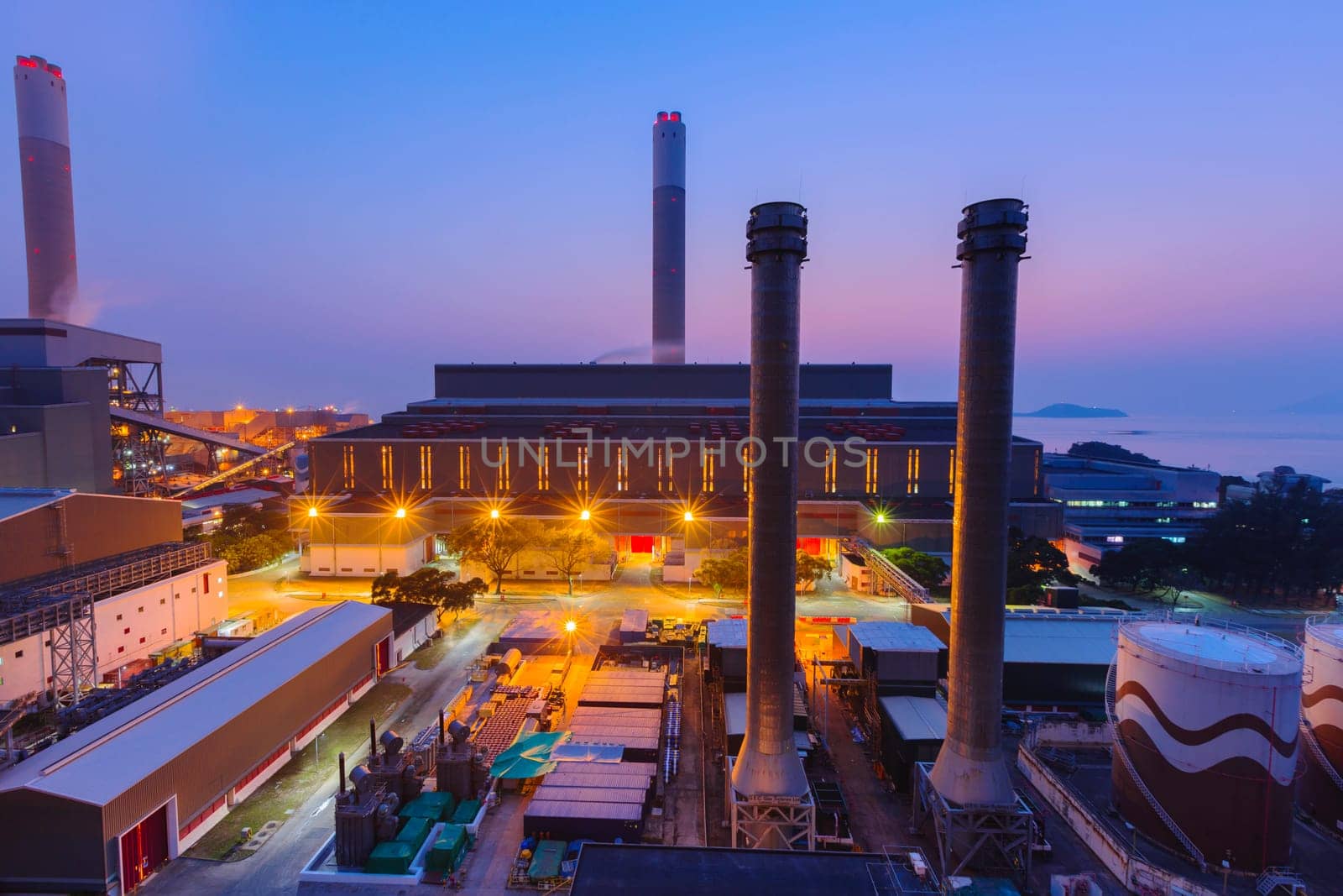 Hong Kong power station at sunset , Glow light of petrochemical industry