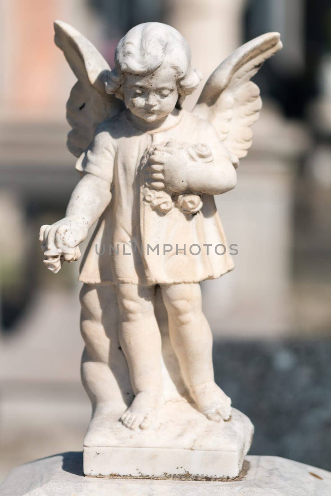 ornamental statuette for the graves of the cemetery