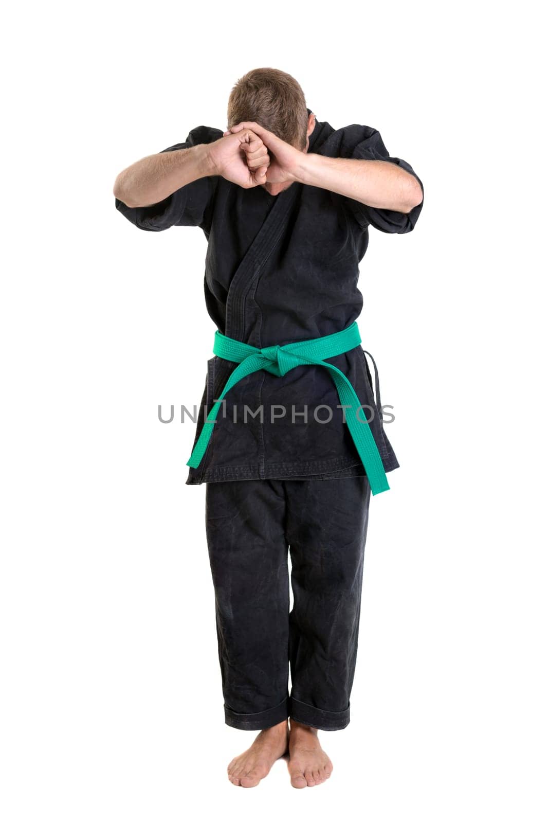Martial arts student isolated in a white background