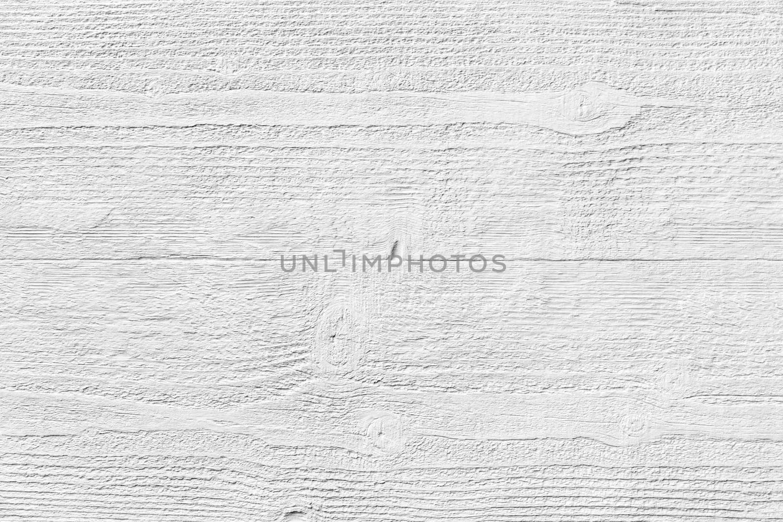 White textured molded gypsum panel on wood