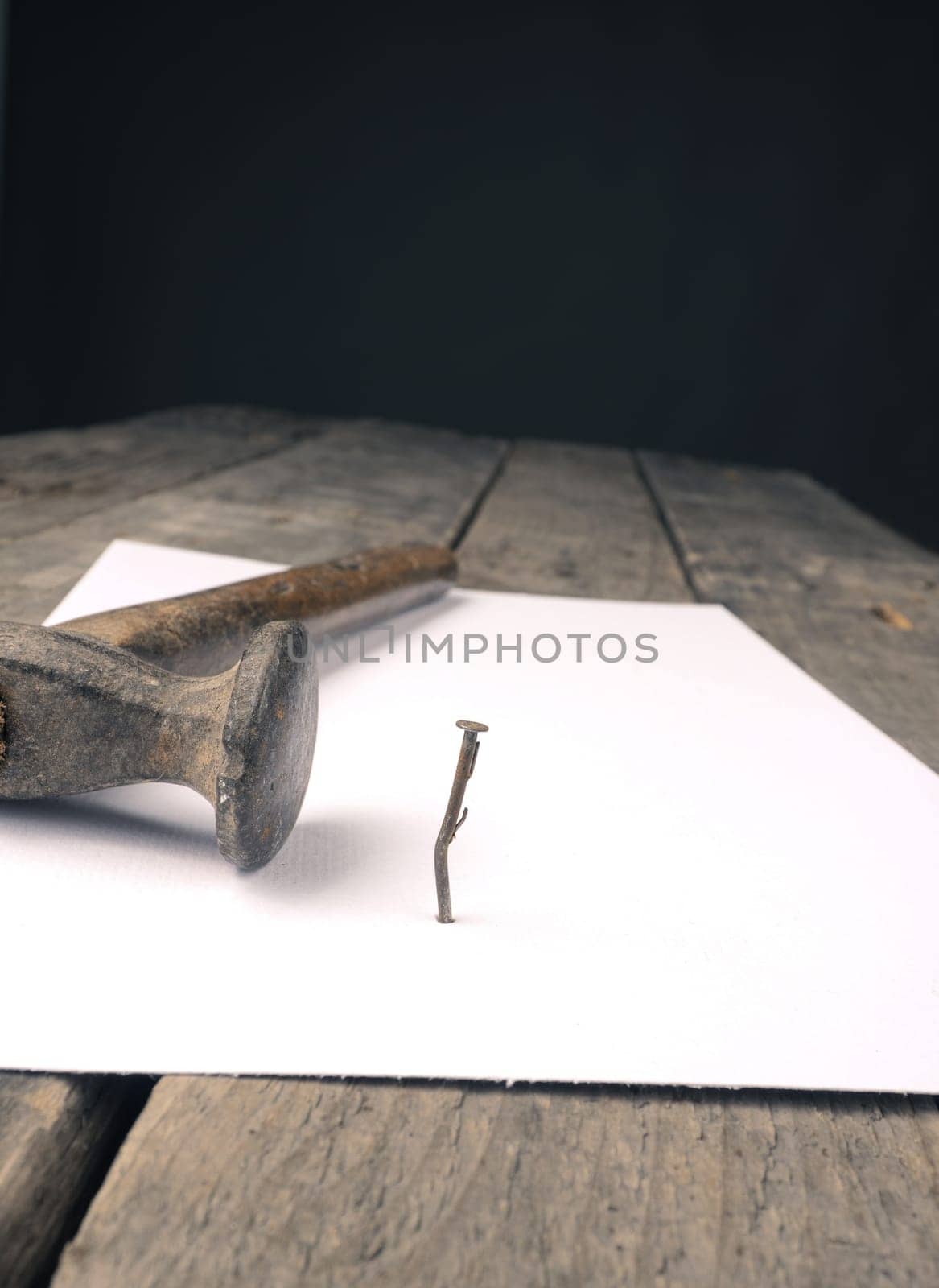Business concept image with a concluding contract, hammer and nail on contract