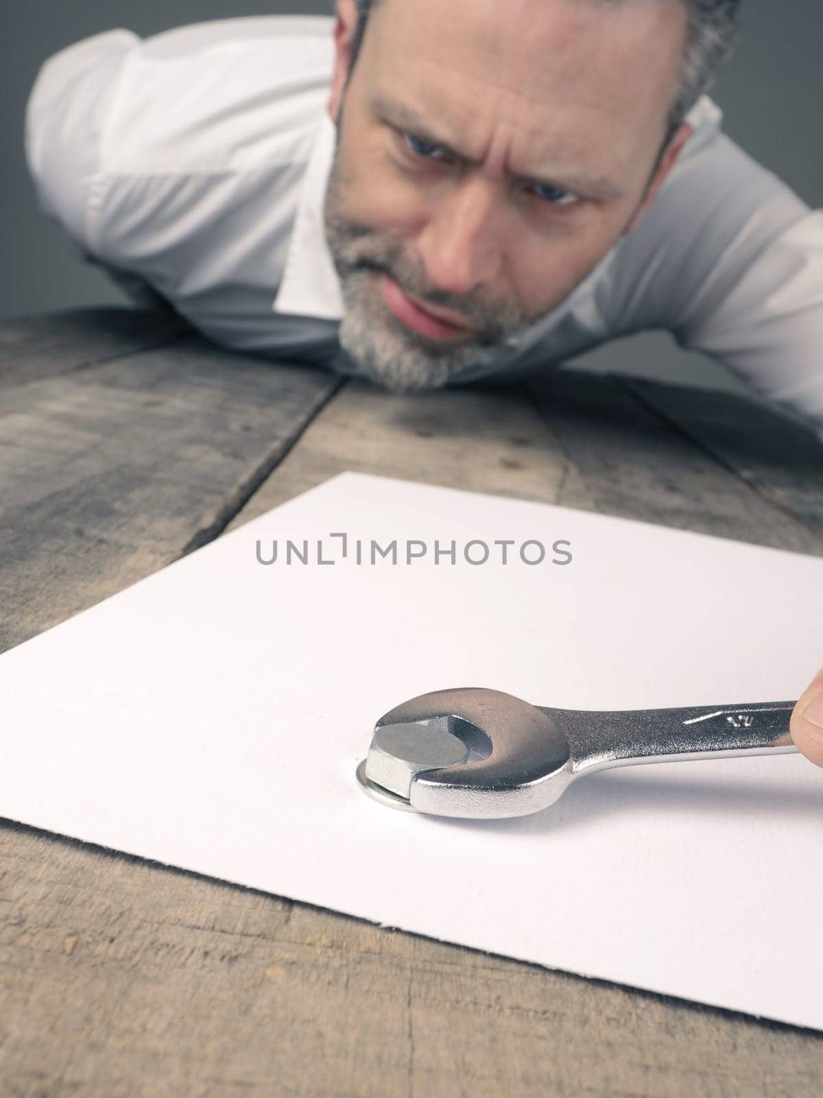 Business concept image with a concluding contract using a wrench and nut