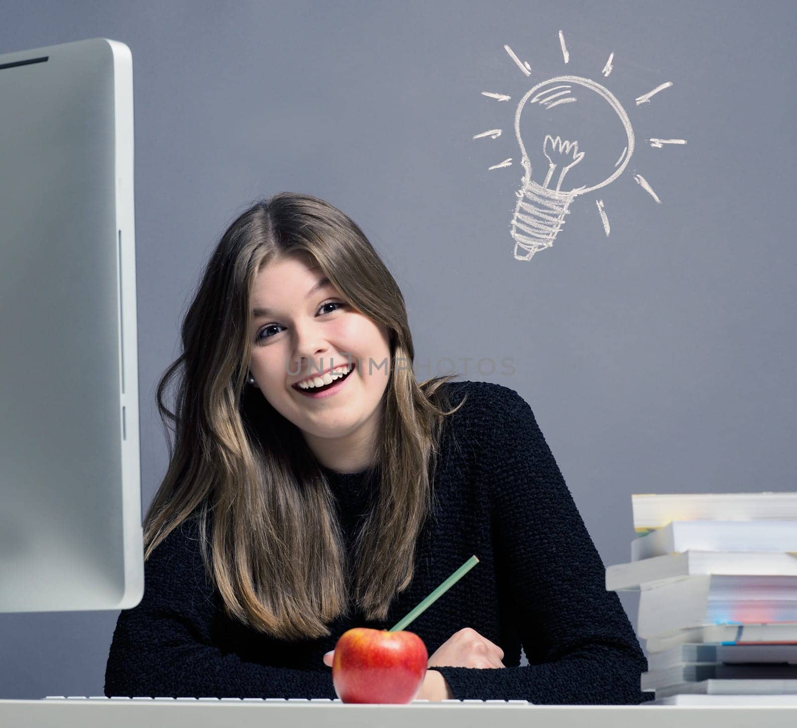 Young woman in an office working on a computer, great idea concept