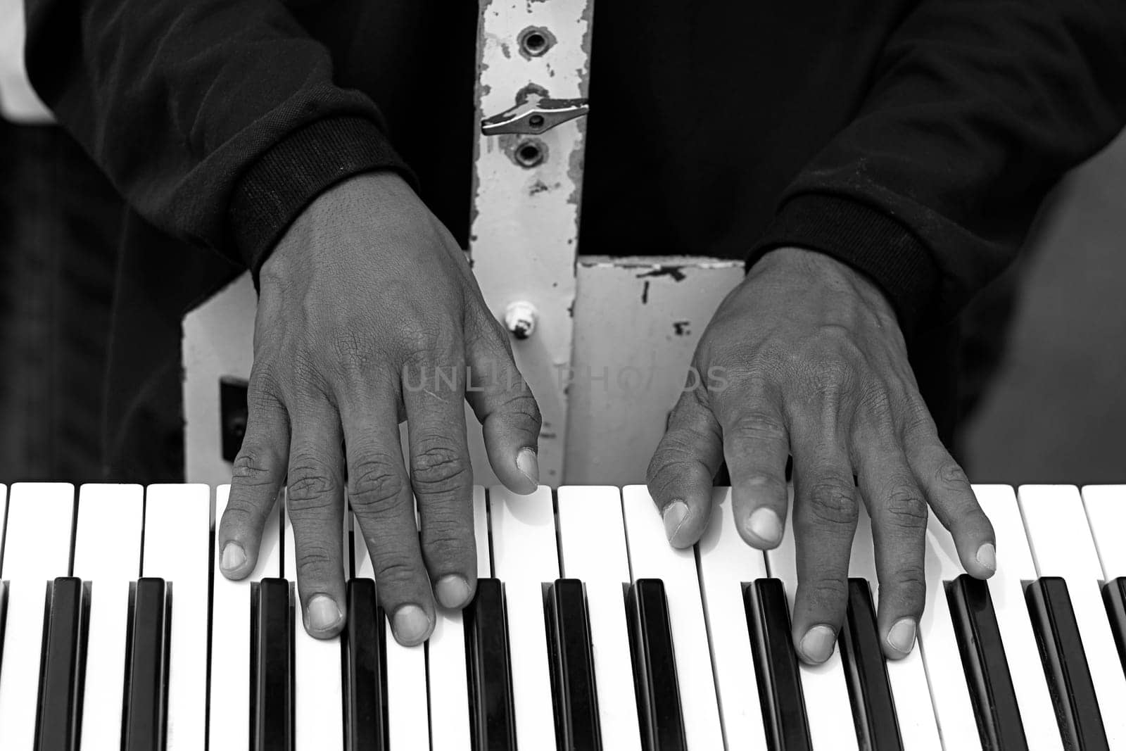 men playing piano close up black white