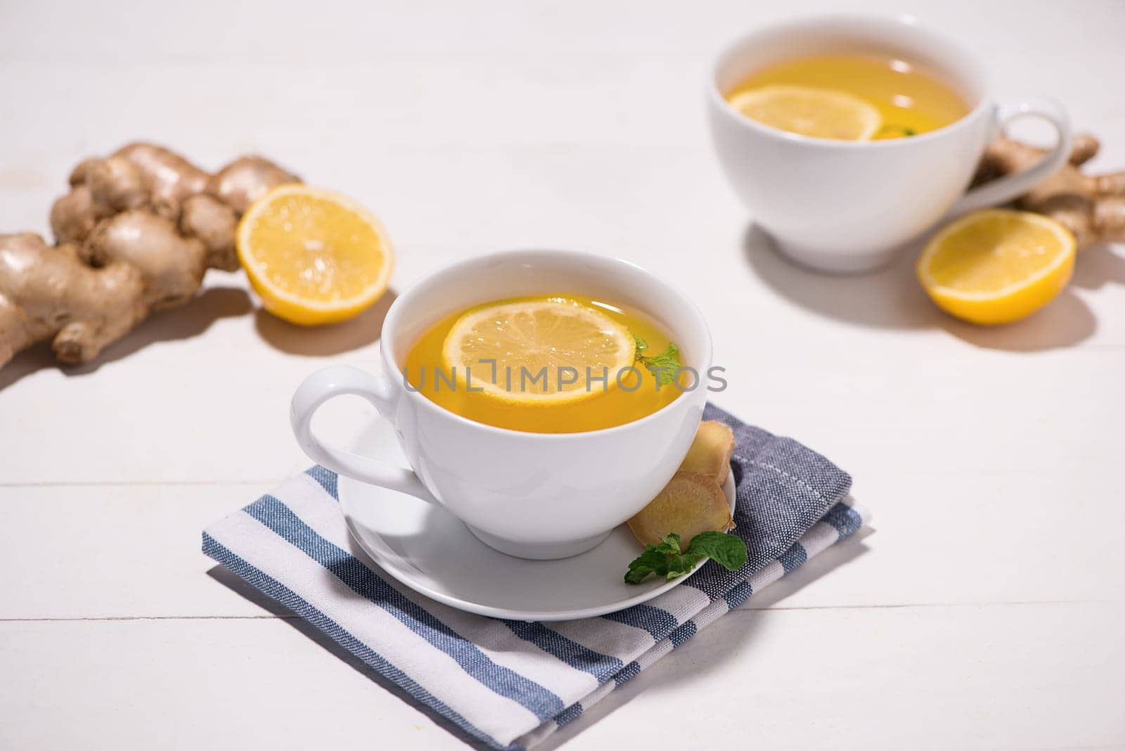 Healthy ginger tea ingredients on a wooden table