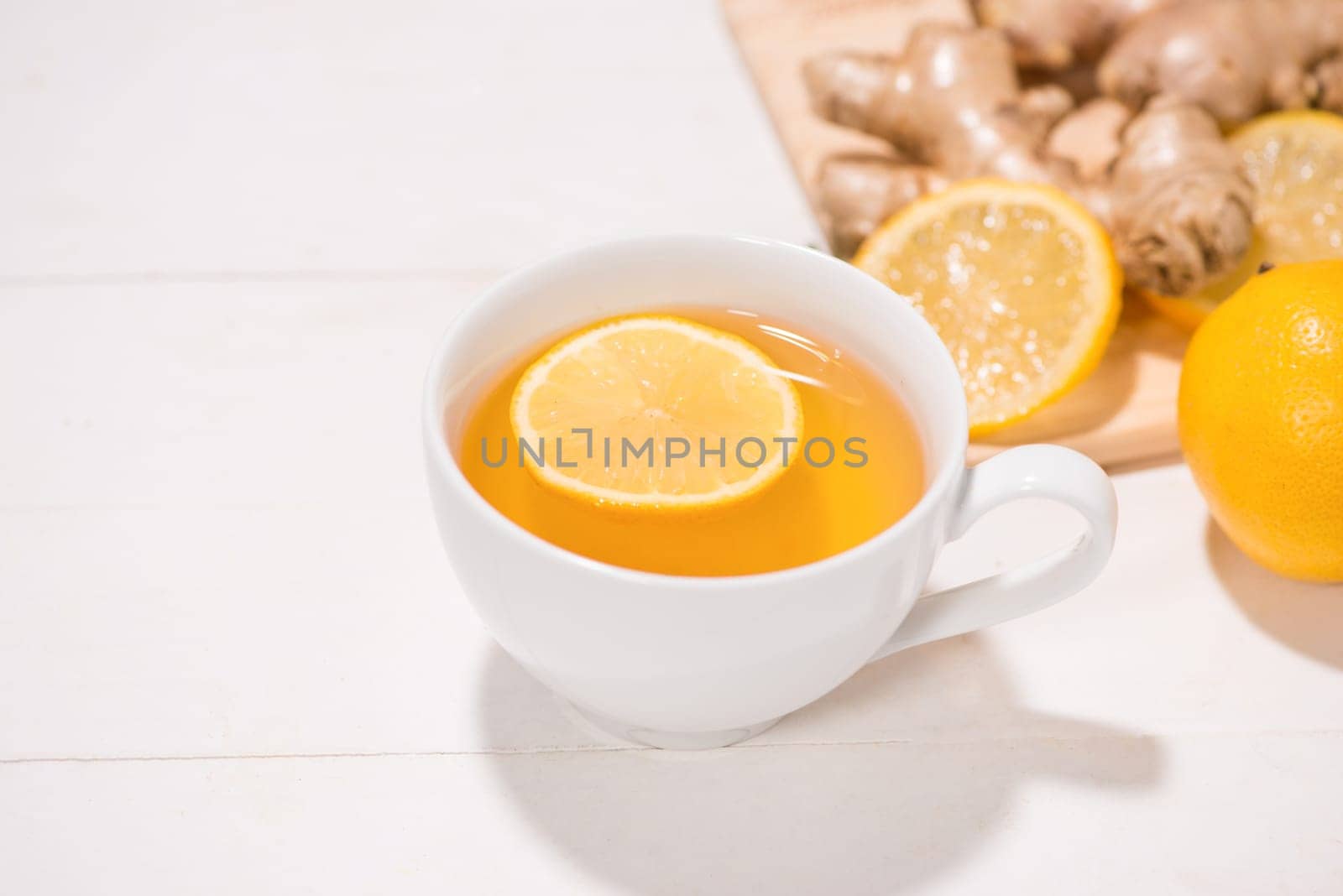 Healthy ginger tea ingredients on a wooden table