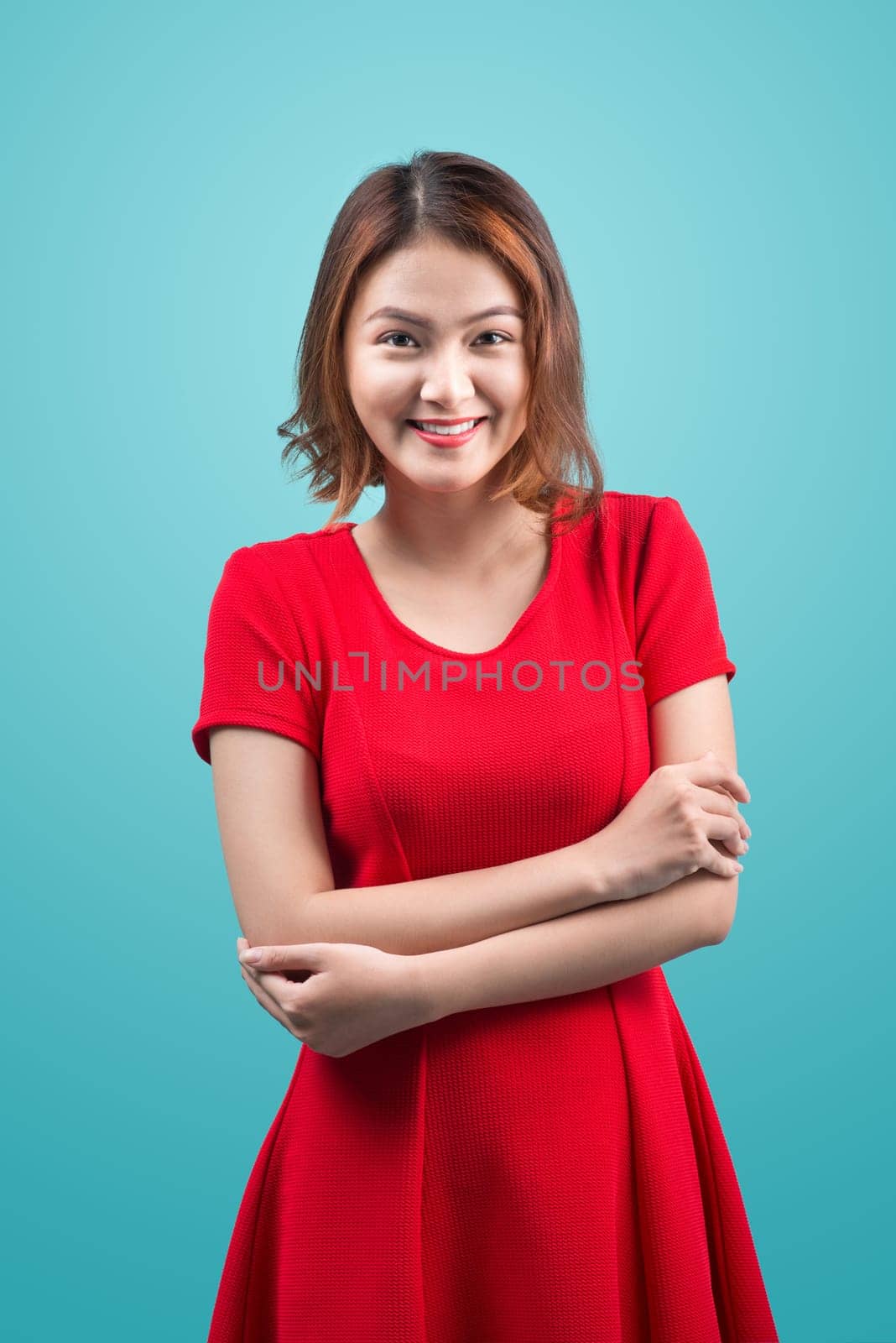 Shopping woman smiling joyful isolated on blue.