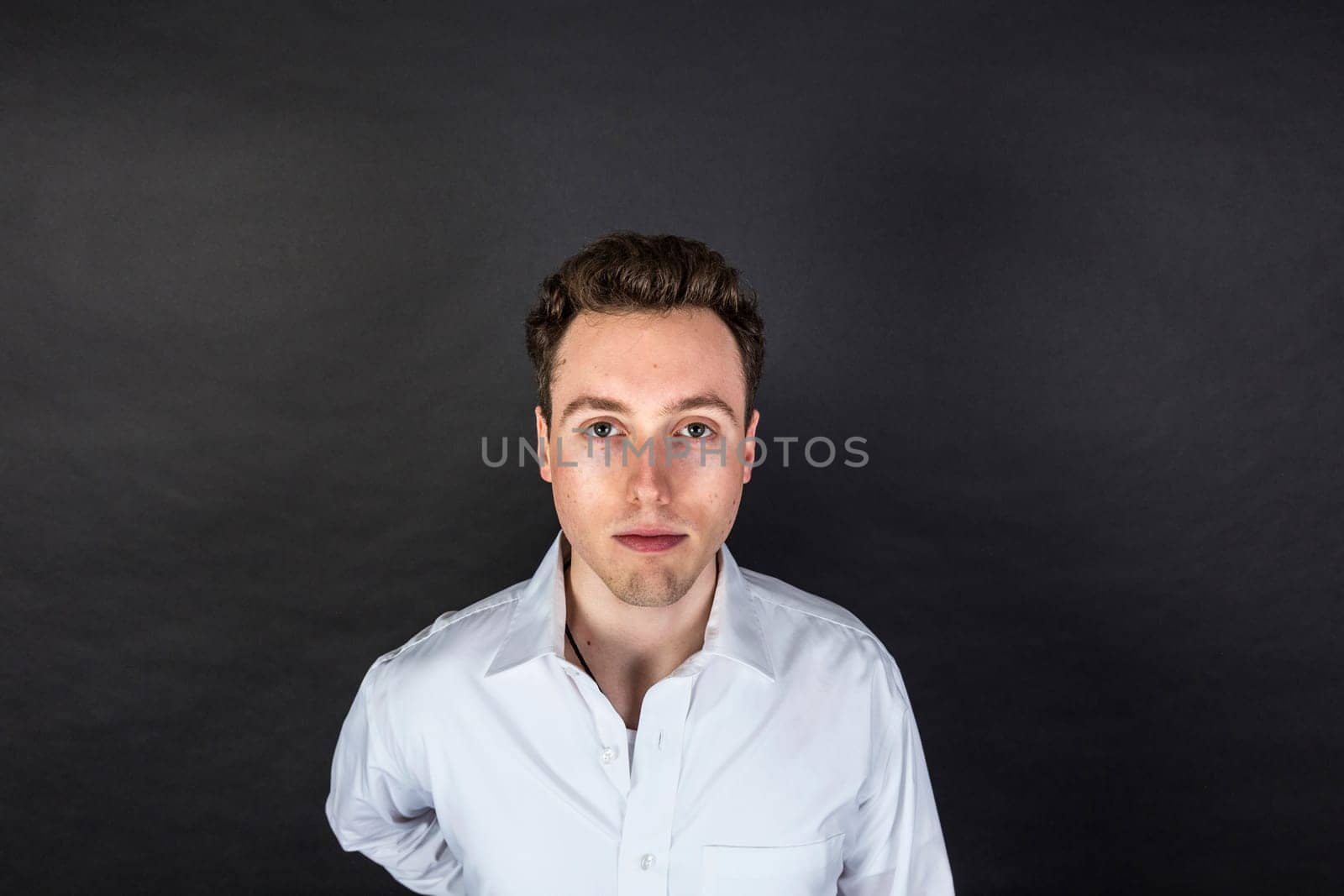 cute smiling teenage boy looks happy and confident