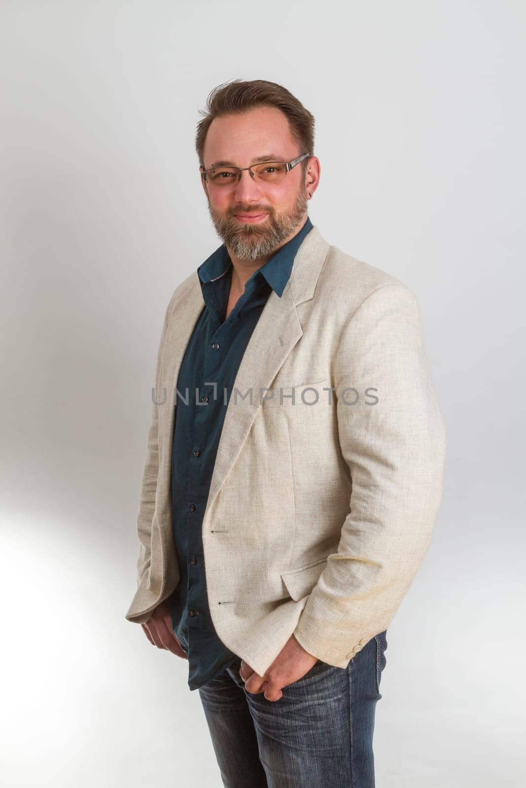 Attractive man standing on a bright background