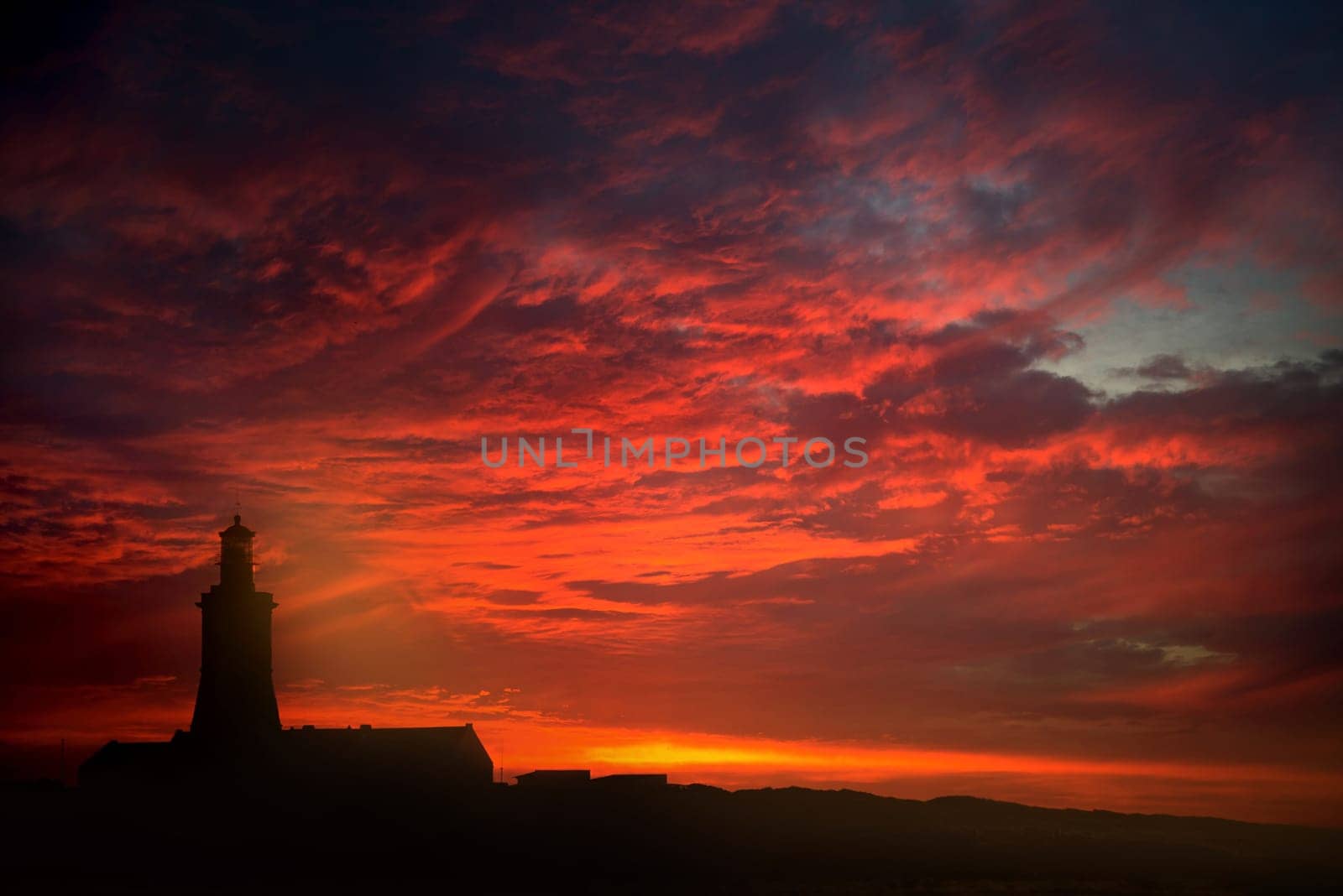 Beautiful Cabo Espichel lighthouse in Portugal, by sunset