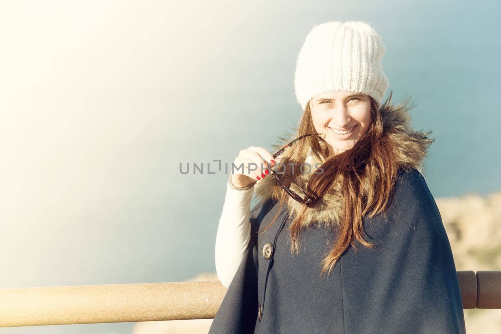 Beautiful and happy young girl posing outdoors