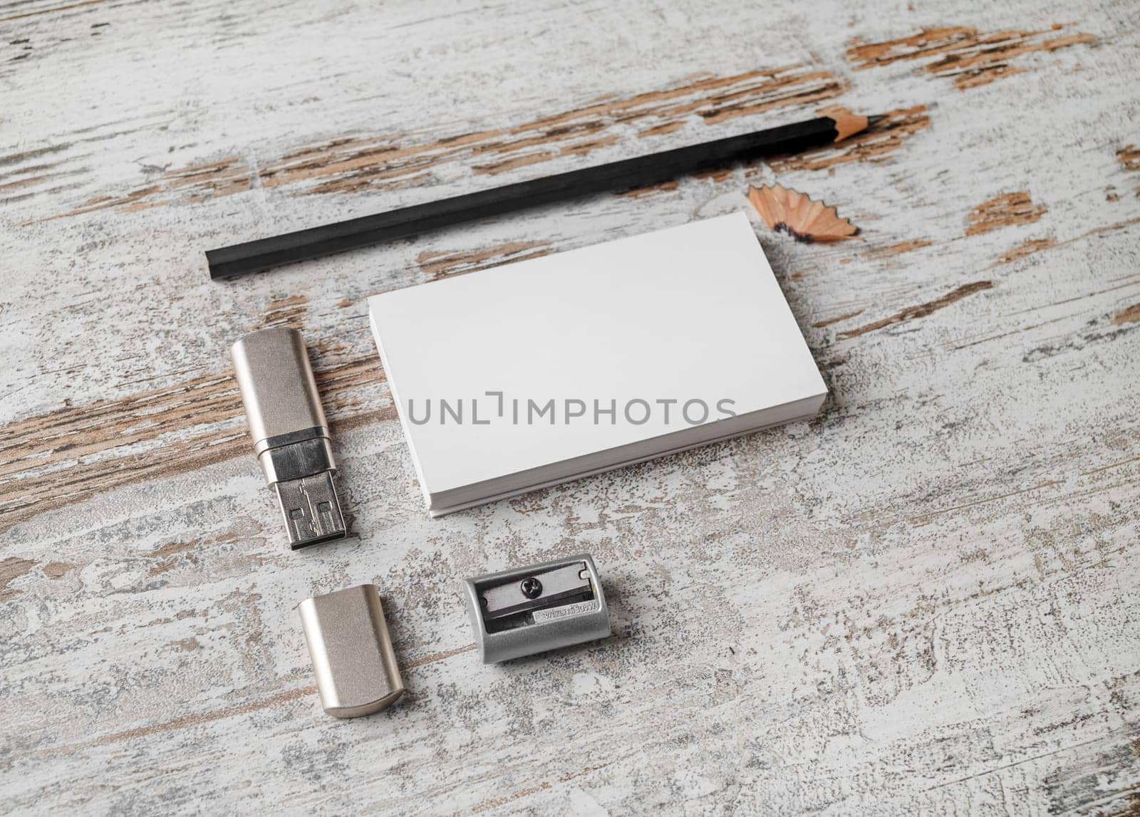 Bank business cards, pencil, flash drive and sharpener. Blank paperwork template. Responsive design mockup on vintage wood background.