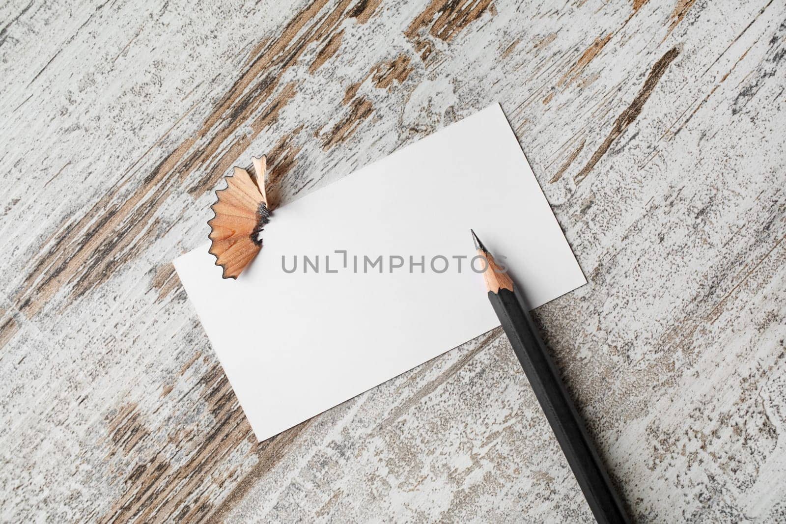 Bank business card and pencil on vintage wooden table background.