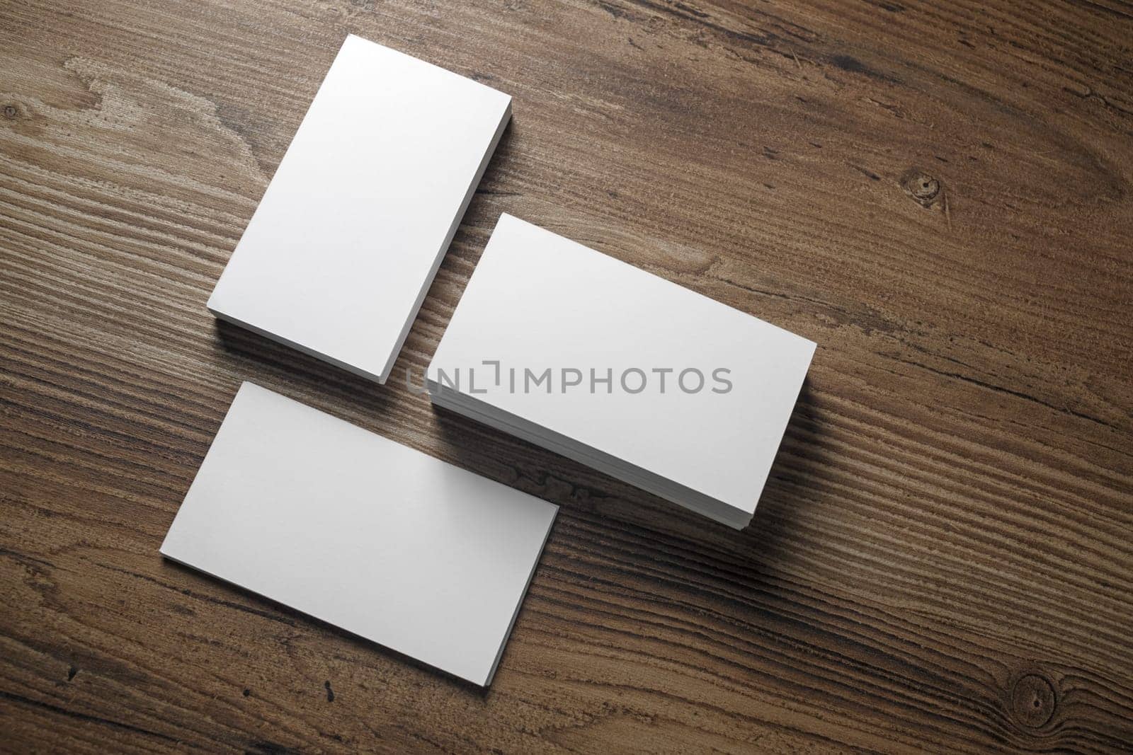 Photo of blank business cards on wooden background. Template for ID. Top view.