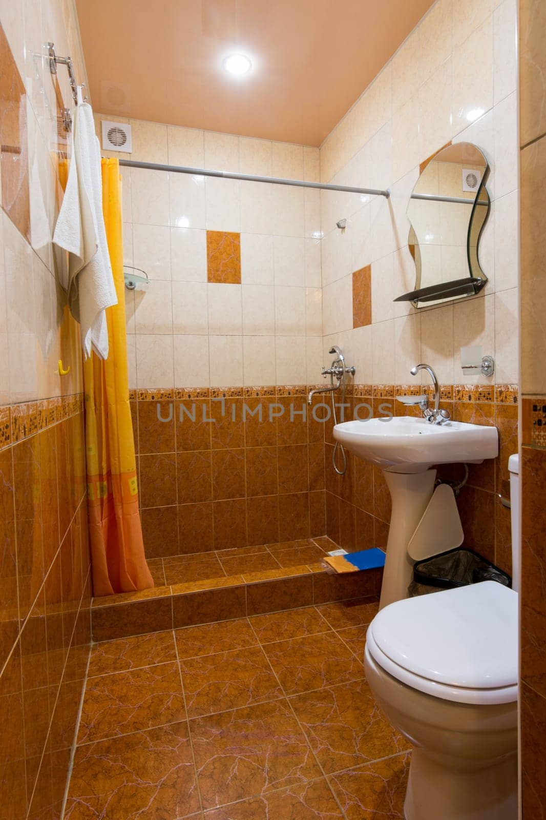 Bathroom combined with toilet in the hotel, general view