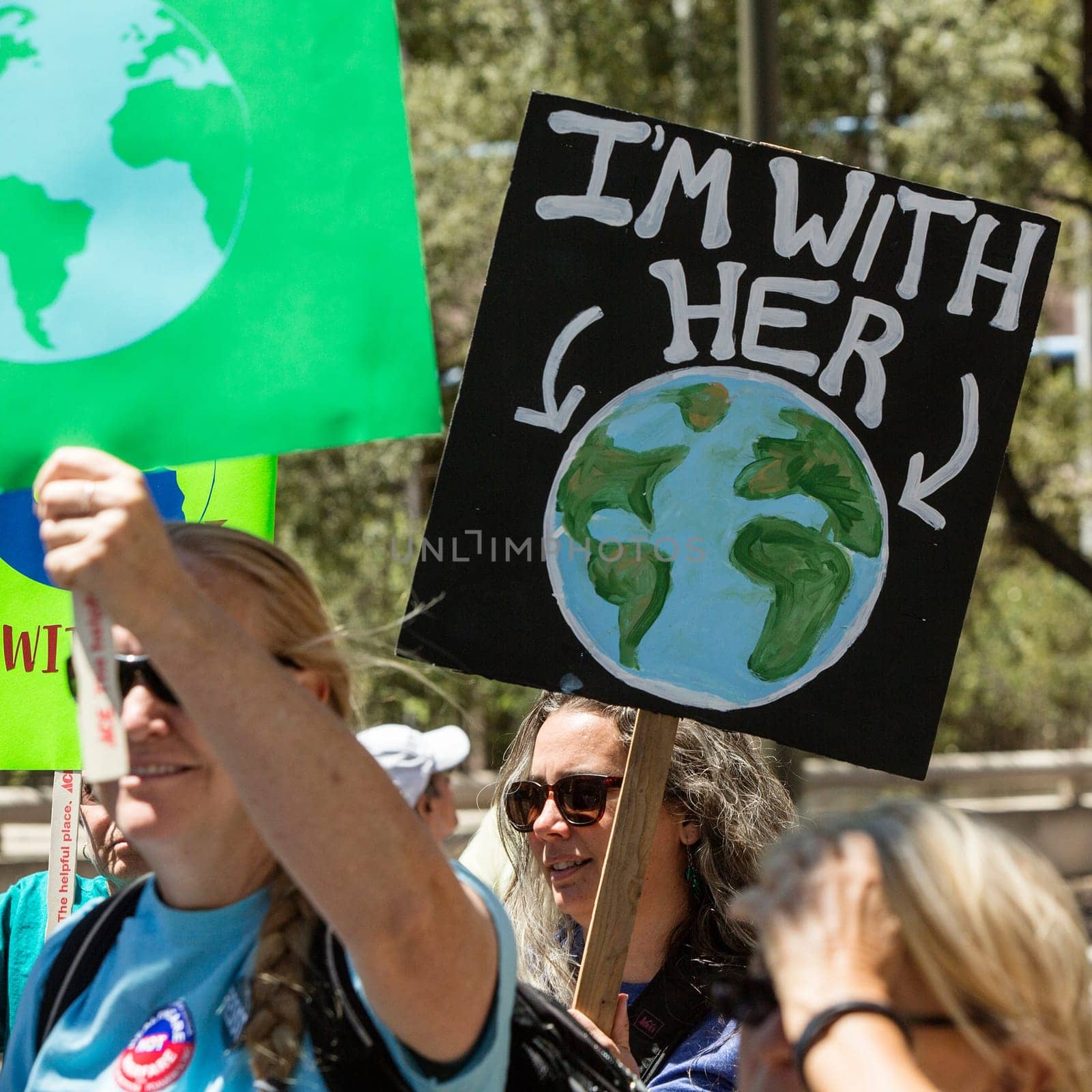 TUCSON, AZ - APRIL 29:  Unidentified protestor with Earth  sign during the Climate March on April 29, 2017 in Tucson, AZ, USA.