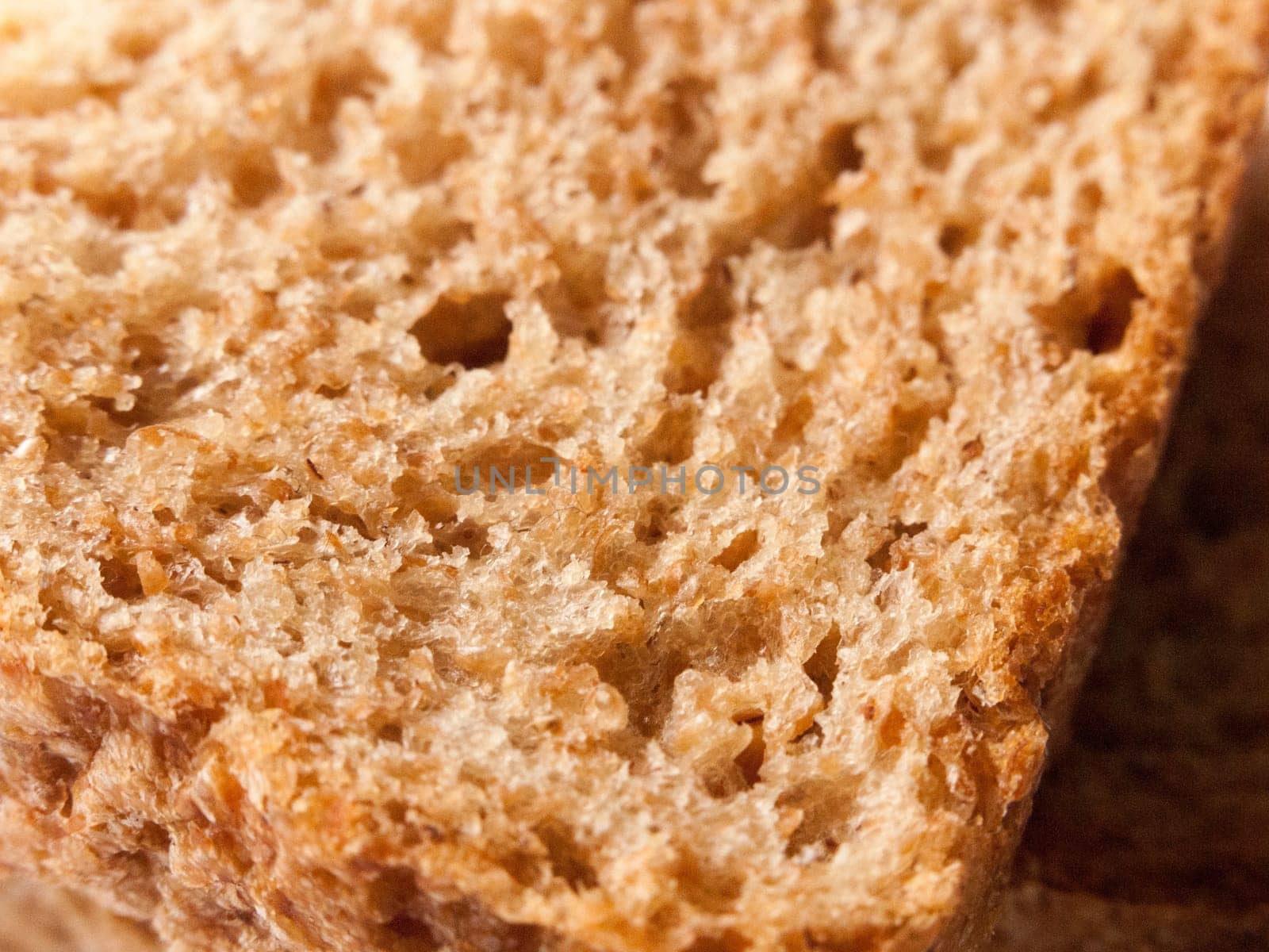 close up texture of soft brown bread studio