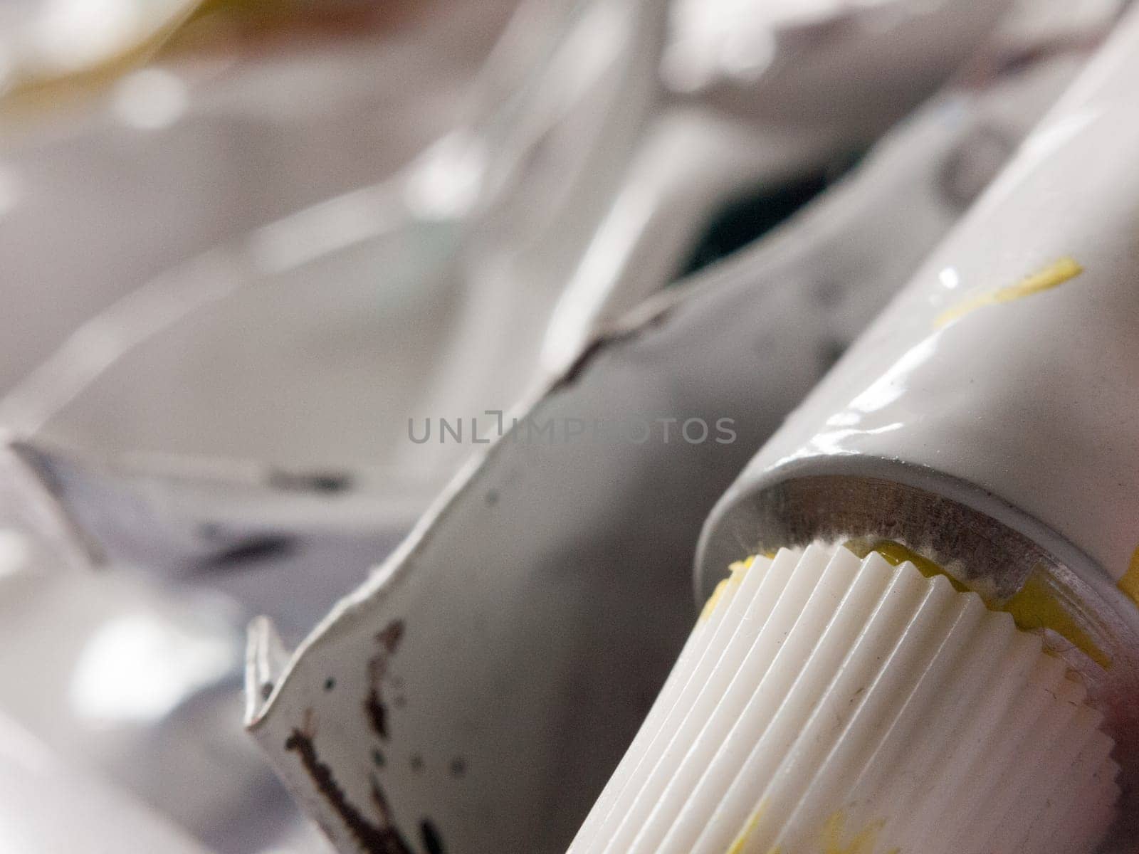 close up detail of paint tubes used and in box in studio