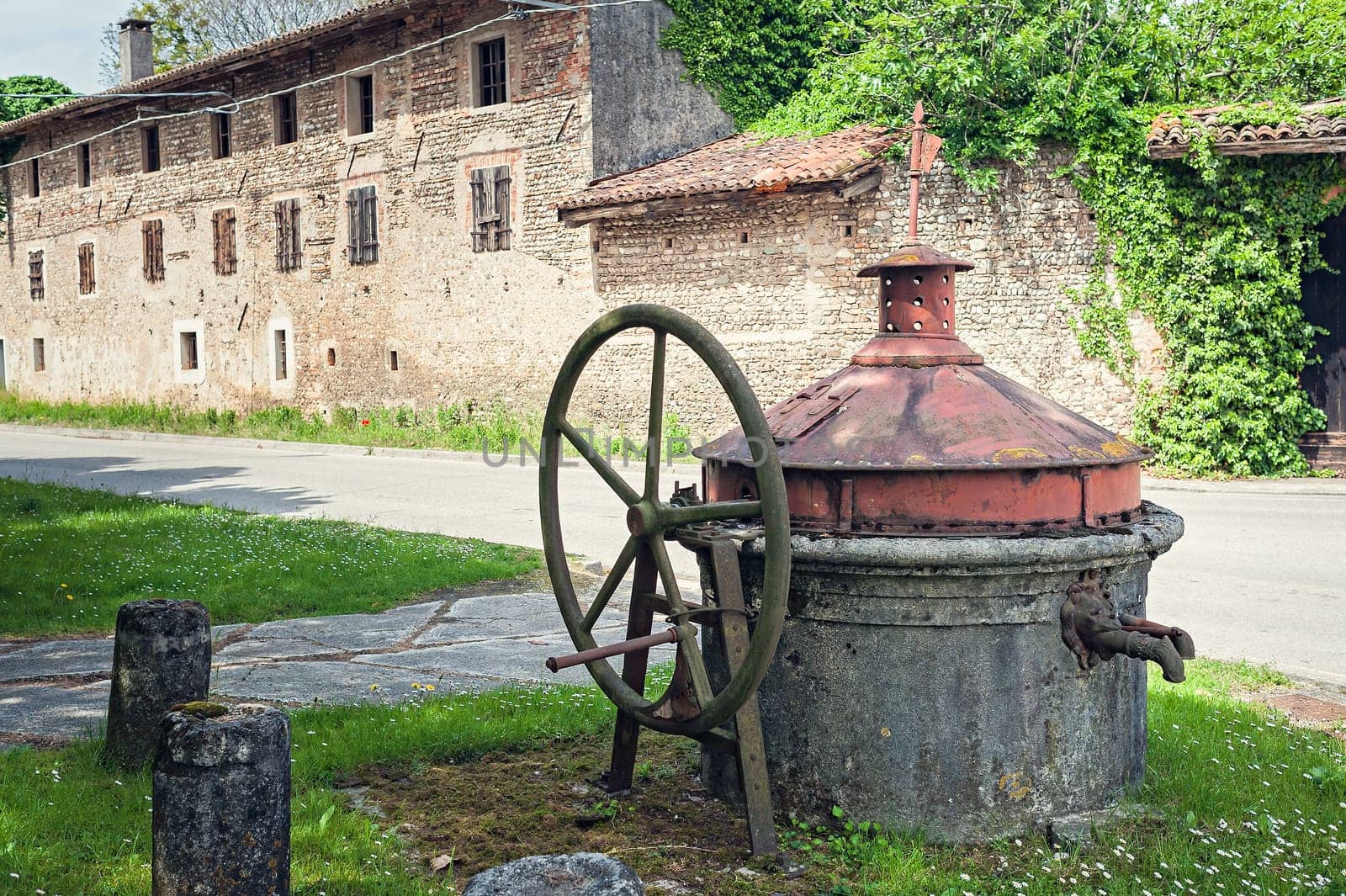 Old well covered with hand pump. It needed around the country.