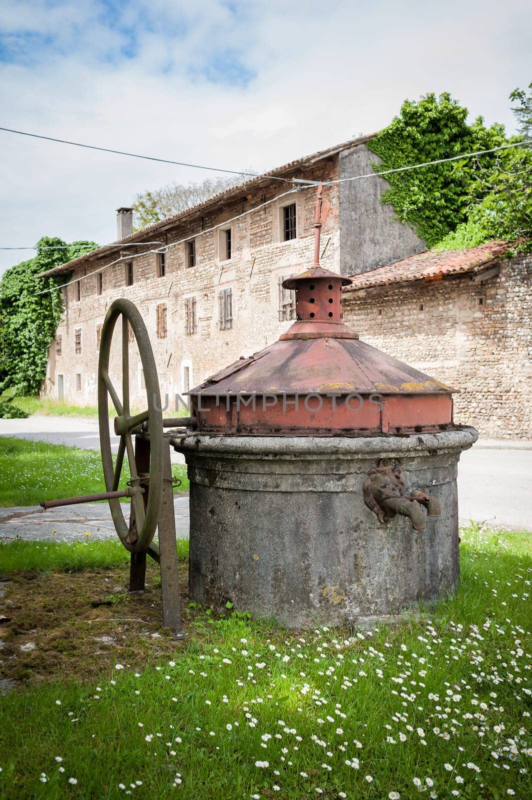 Old well covered with hand pump. It needed around the country.