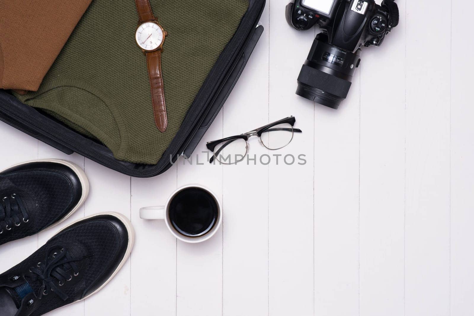 Men's casual outfits with accessories on wooden background