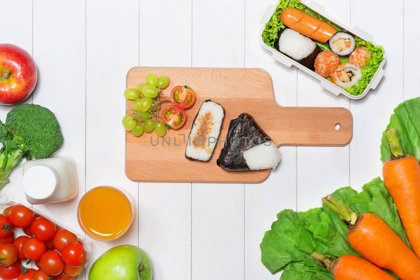 Bento box with different food, fresh veggies and fruits