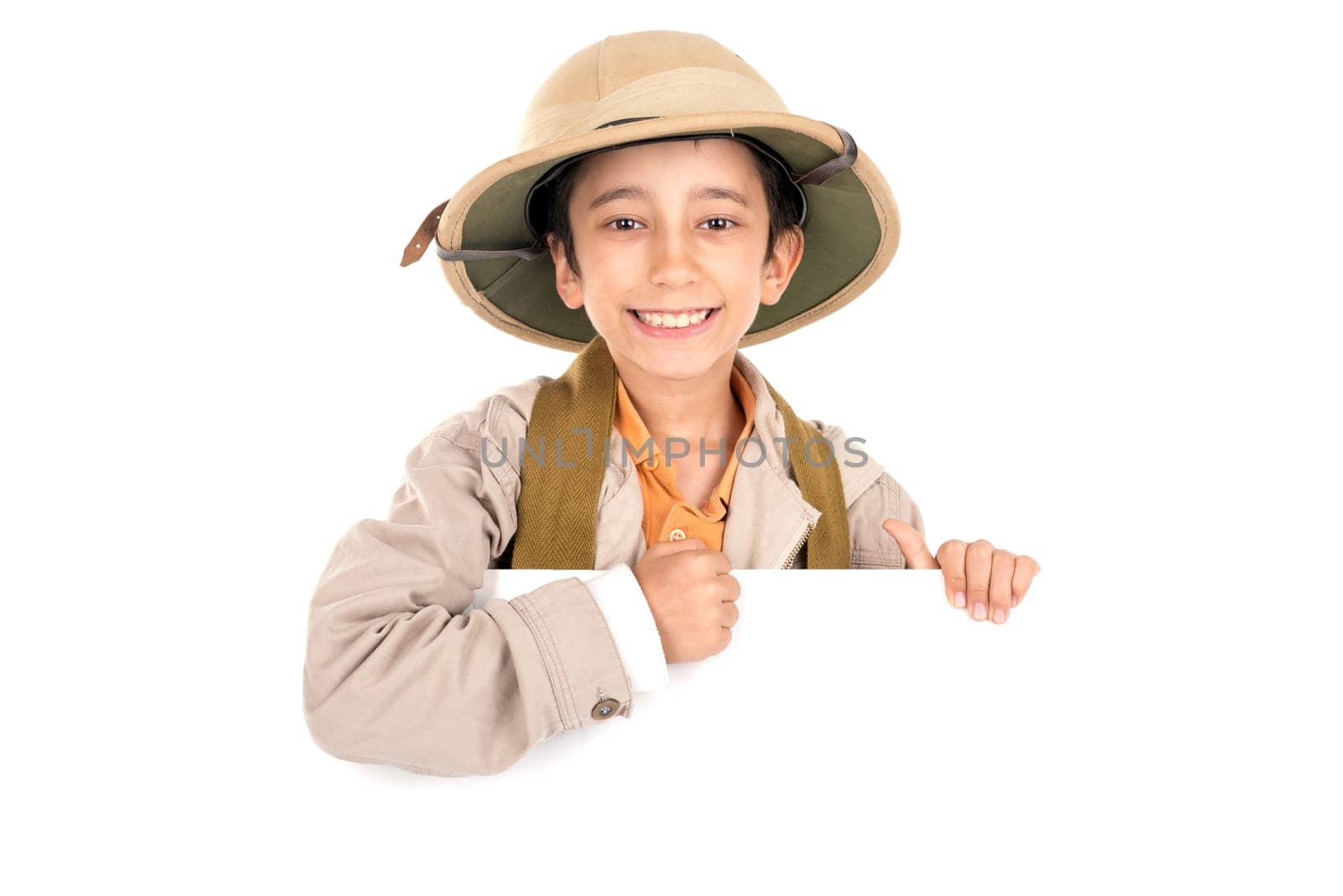 Young boy with Safari clothes behind a white board isolated in white