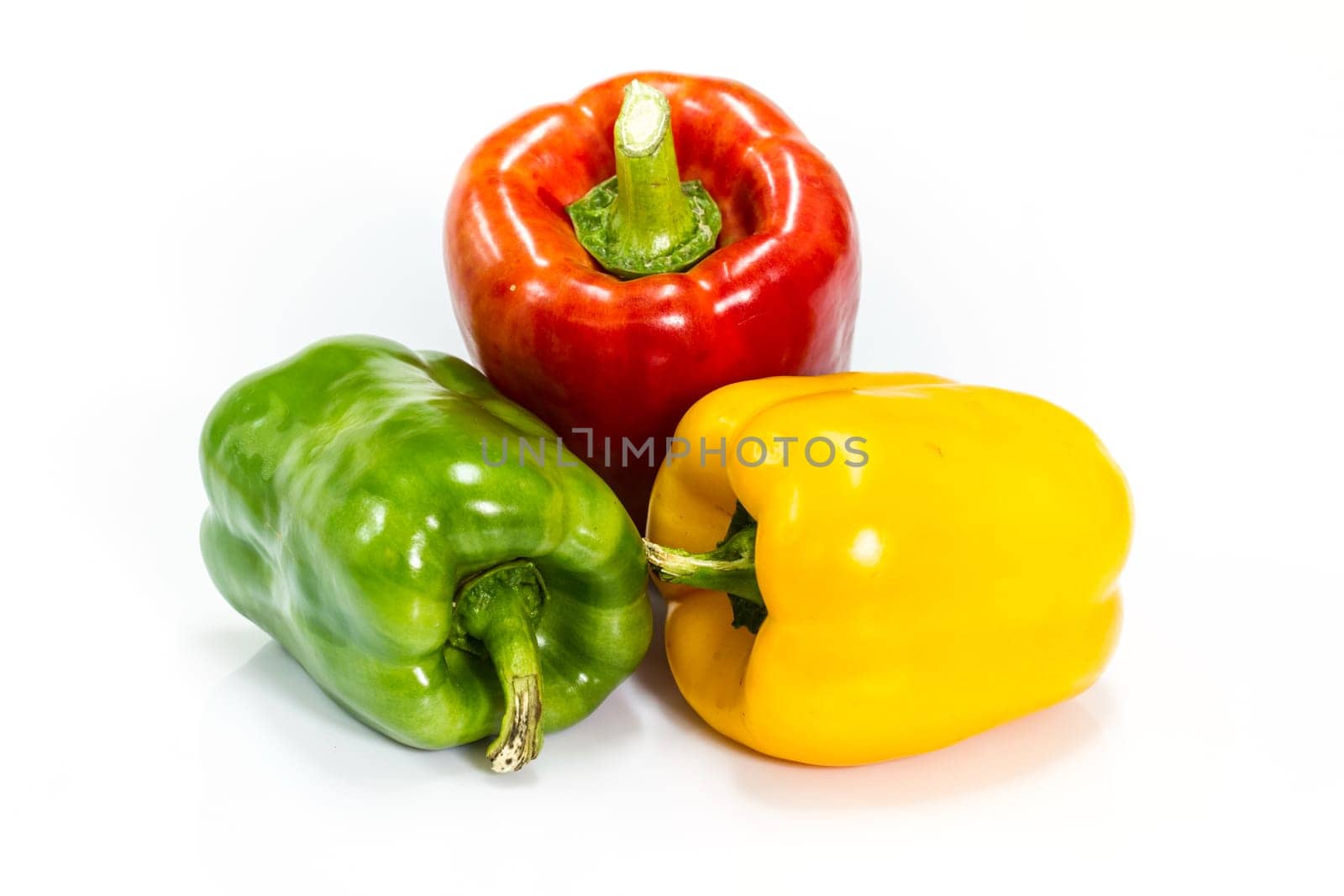 colored peppers over white background, Fresh vegetables sweet Peppers or Bell peppers
